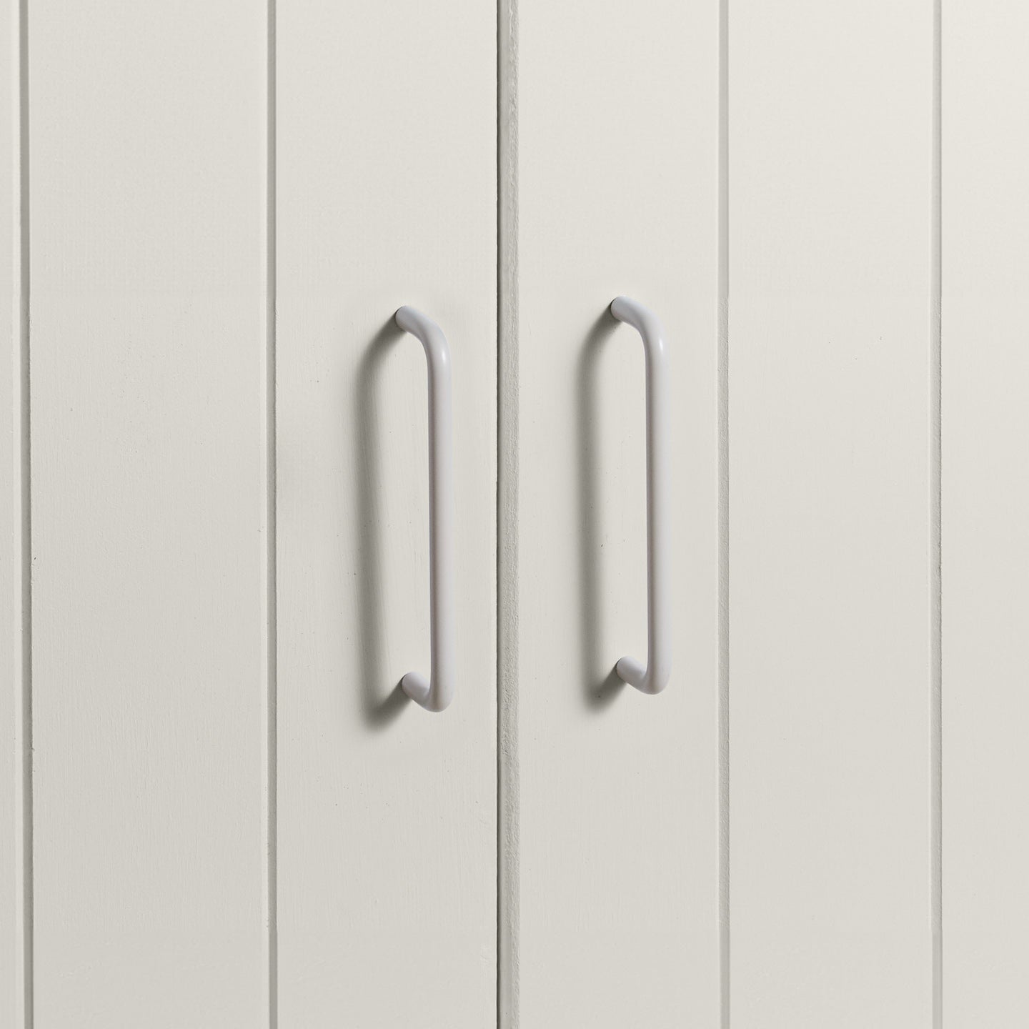 Large ivory pulls on white doors