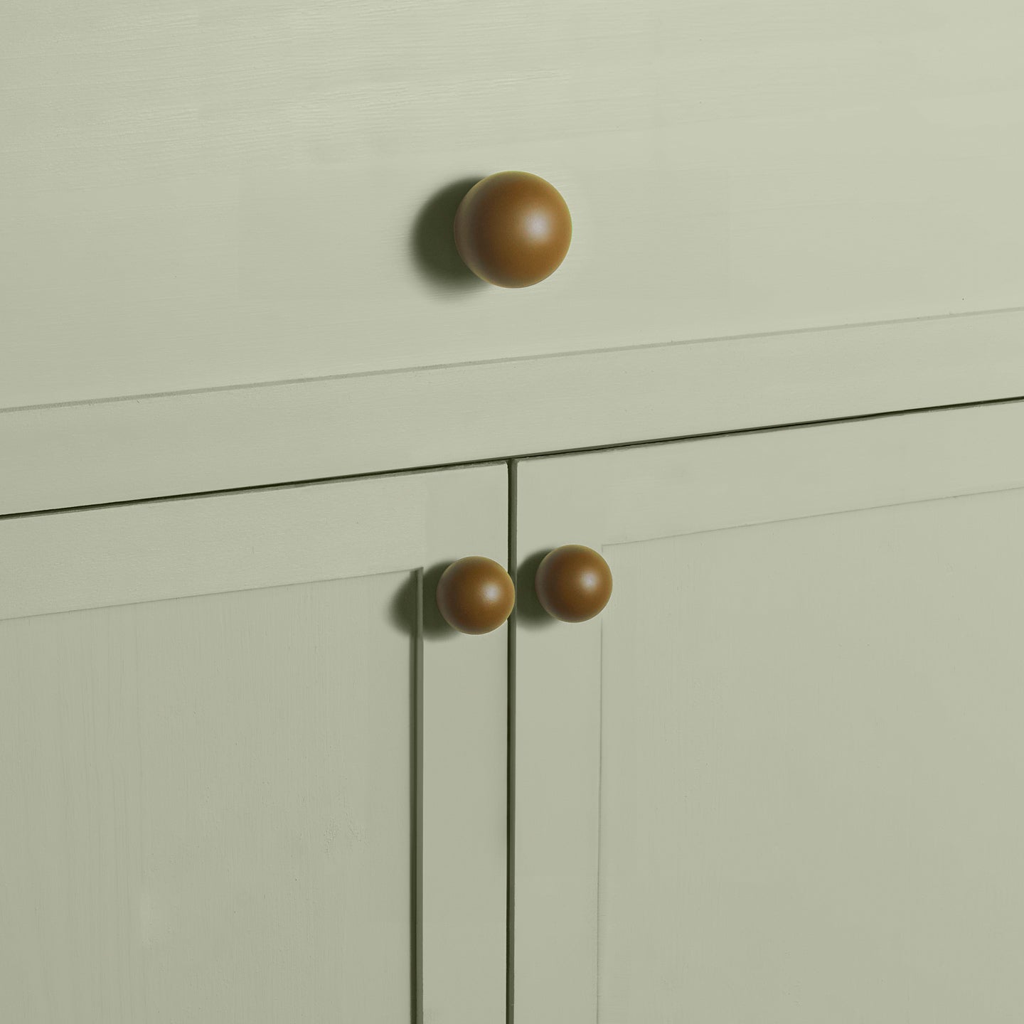 Large and small olive essential sphere knobs on drawers and cabinets