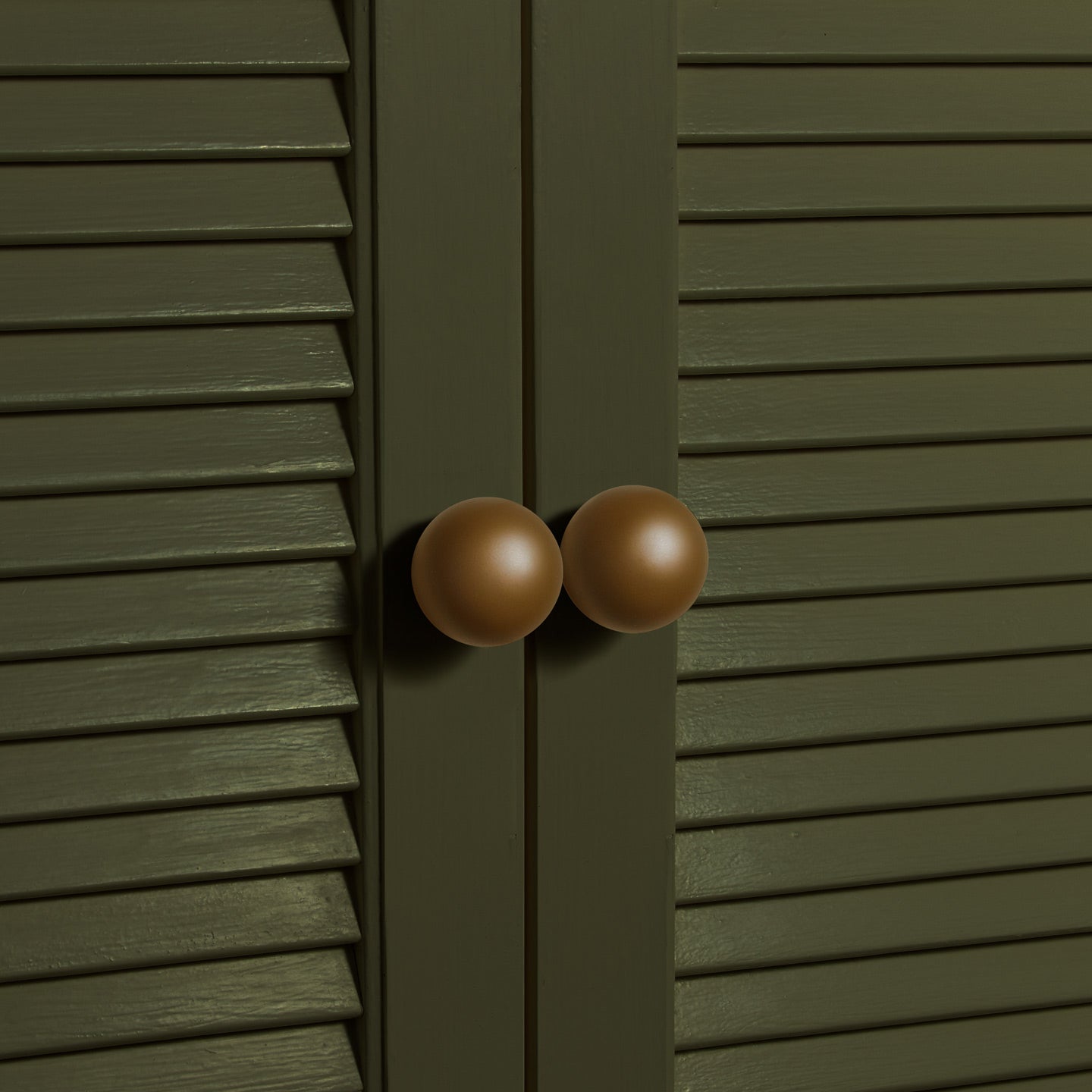 Large olive essential sphere knobs on louvered doors