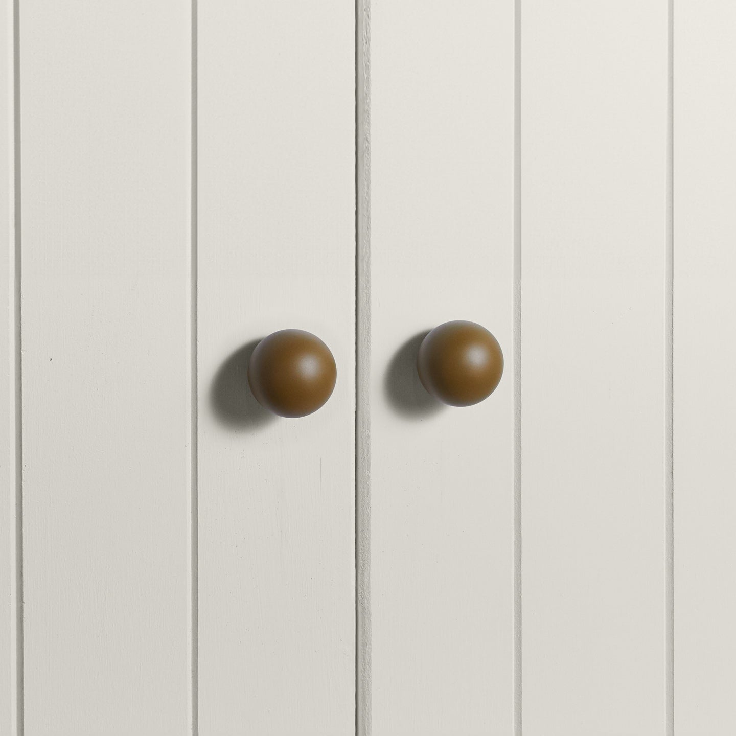 Large olive essential sphere knobs on white doors