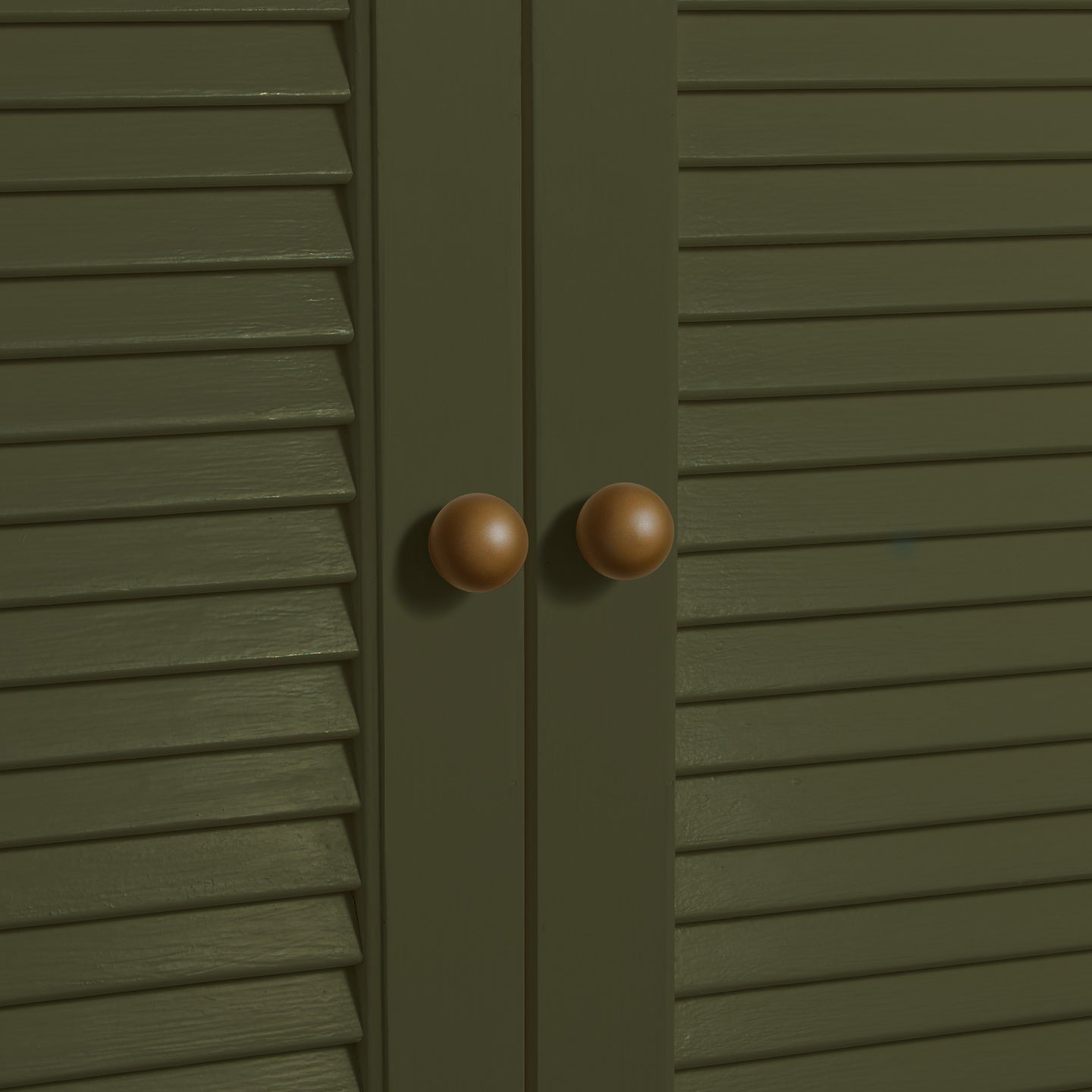 Small olive essential sphere knobs on louvered doors 