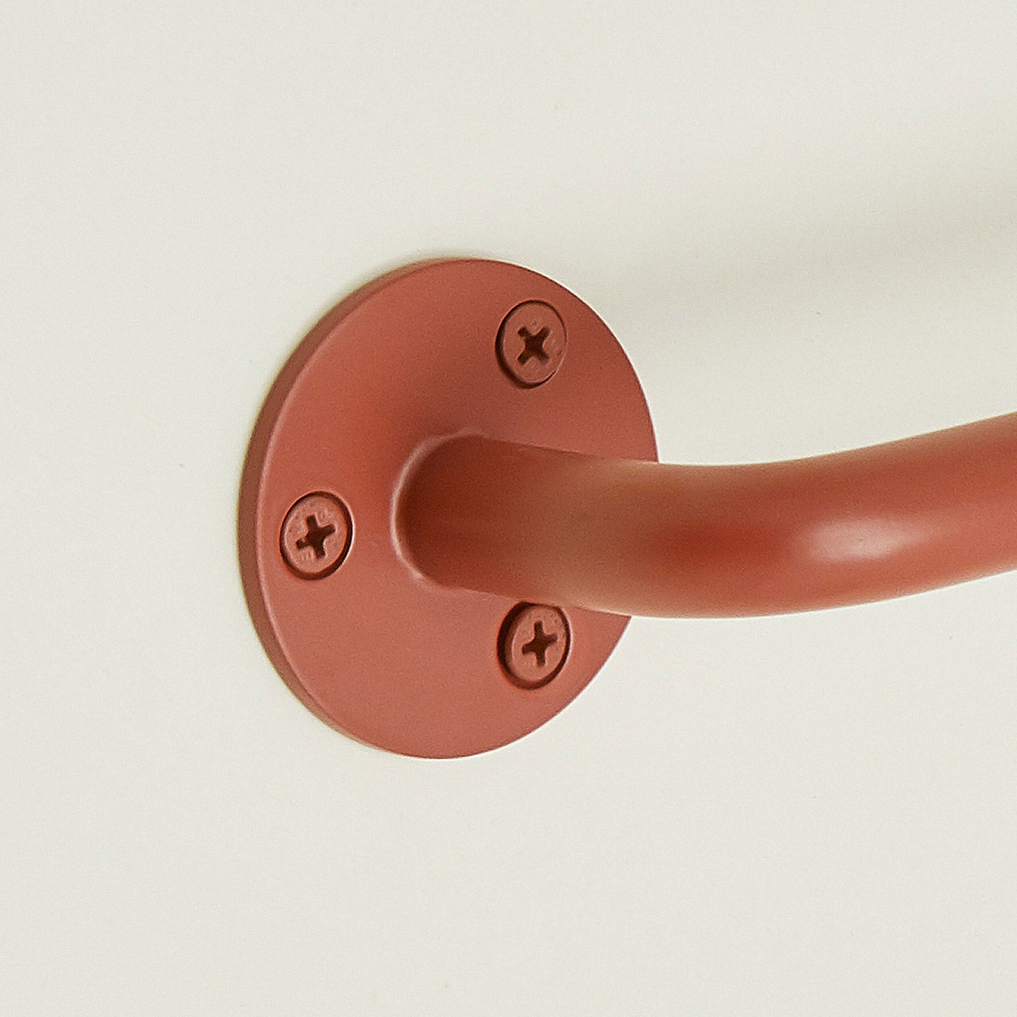 Close up of towel bar in Terracotta.