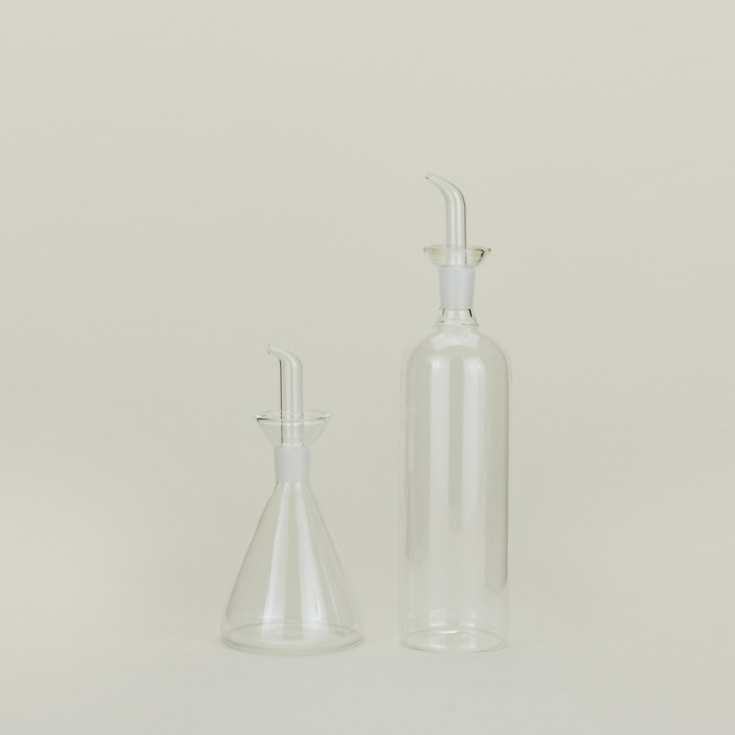 Set of two glass oil and vinegar bottles