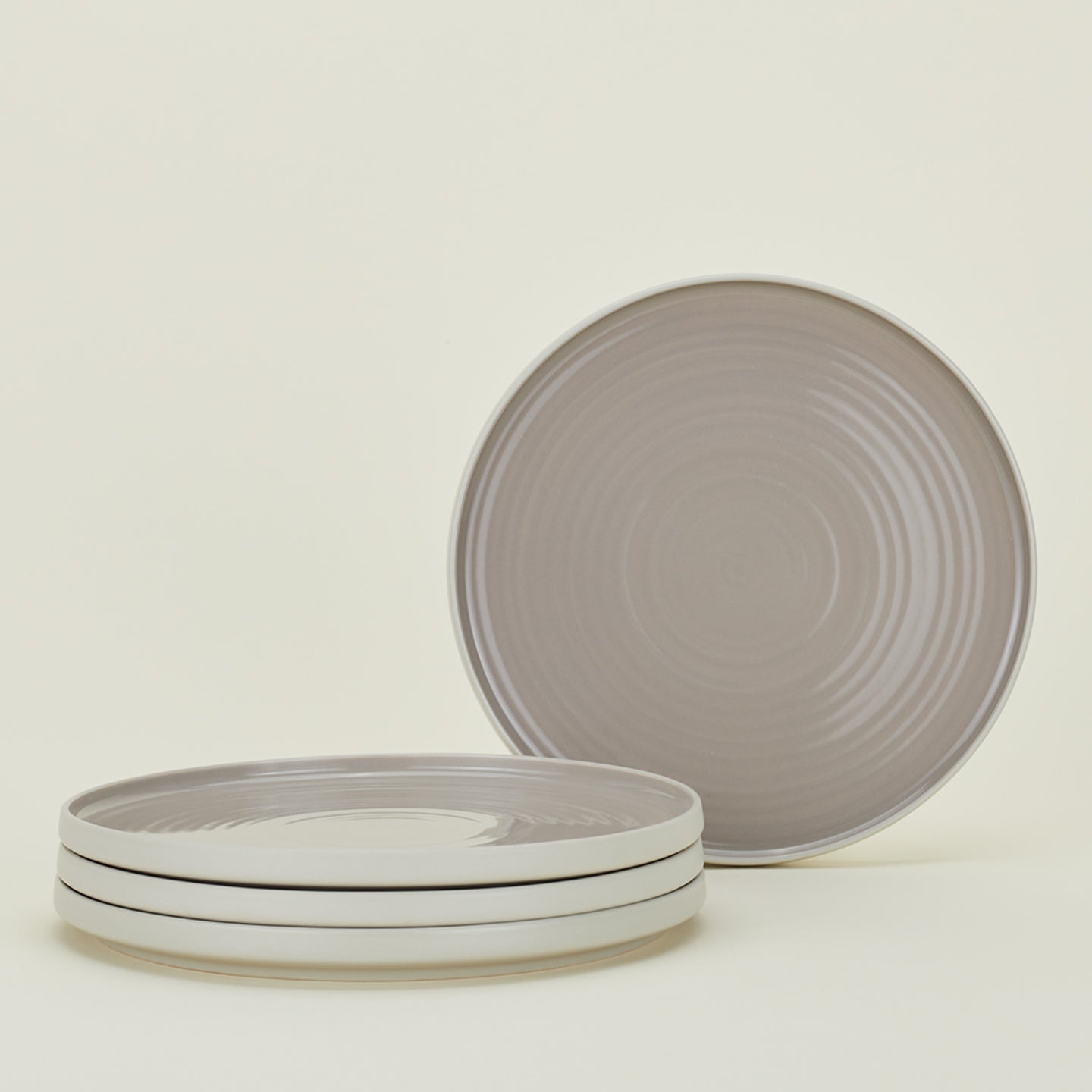 Four light grey Essential Dinner Plates.