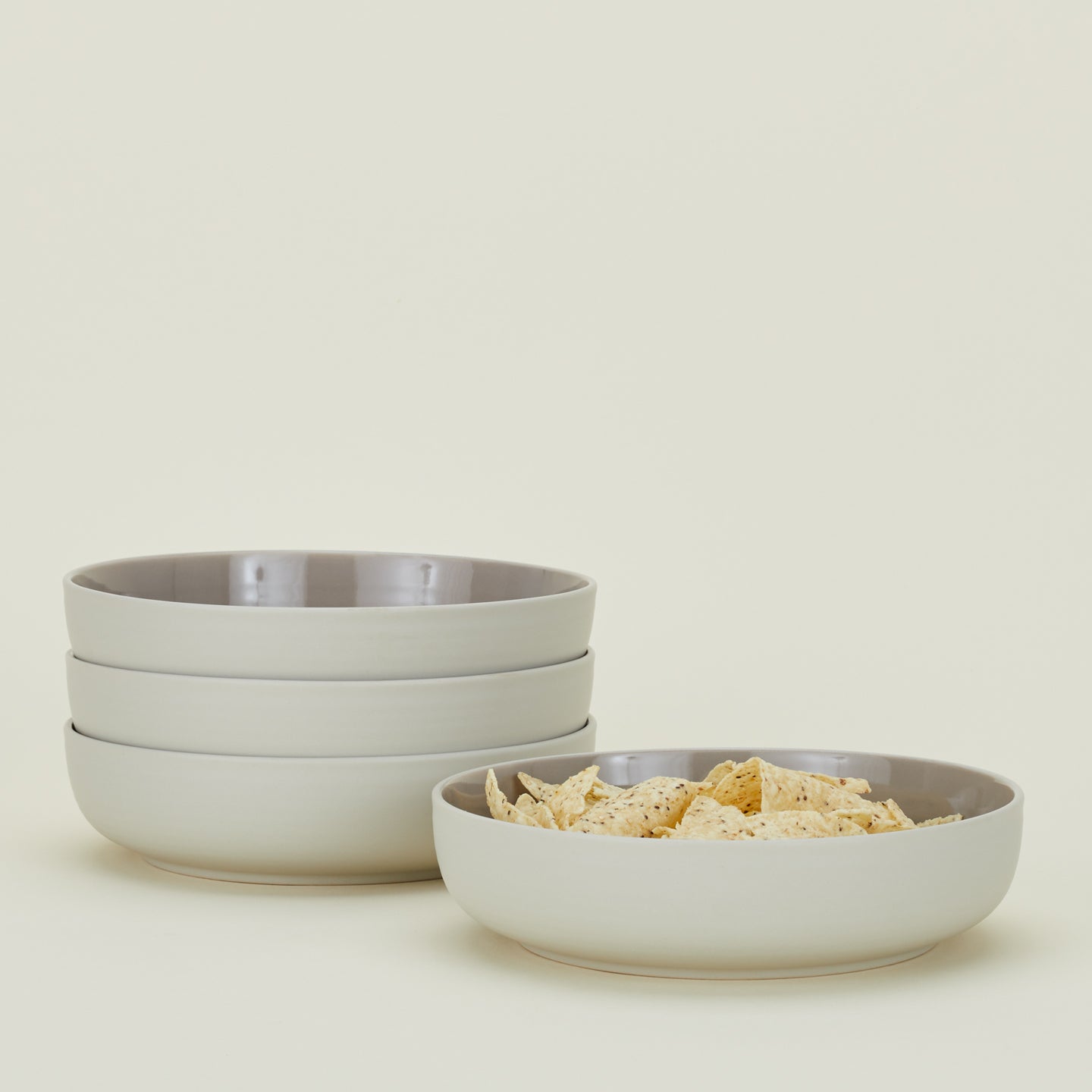 Four Essential Low Bowls in Light Grey, with tortilla chips.