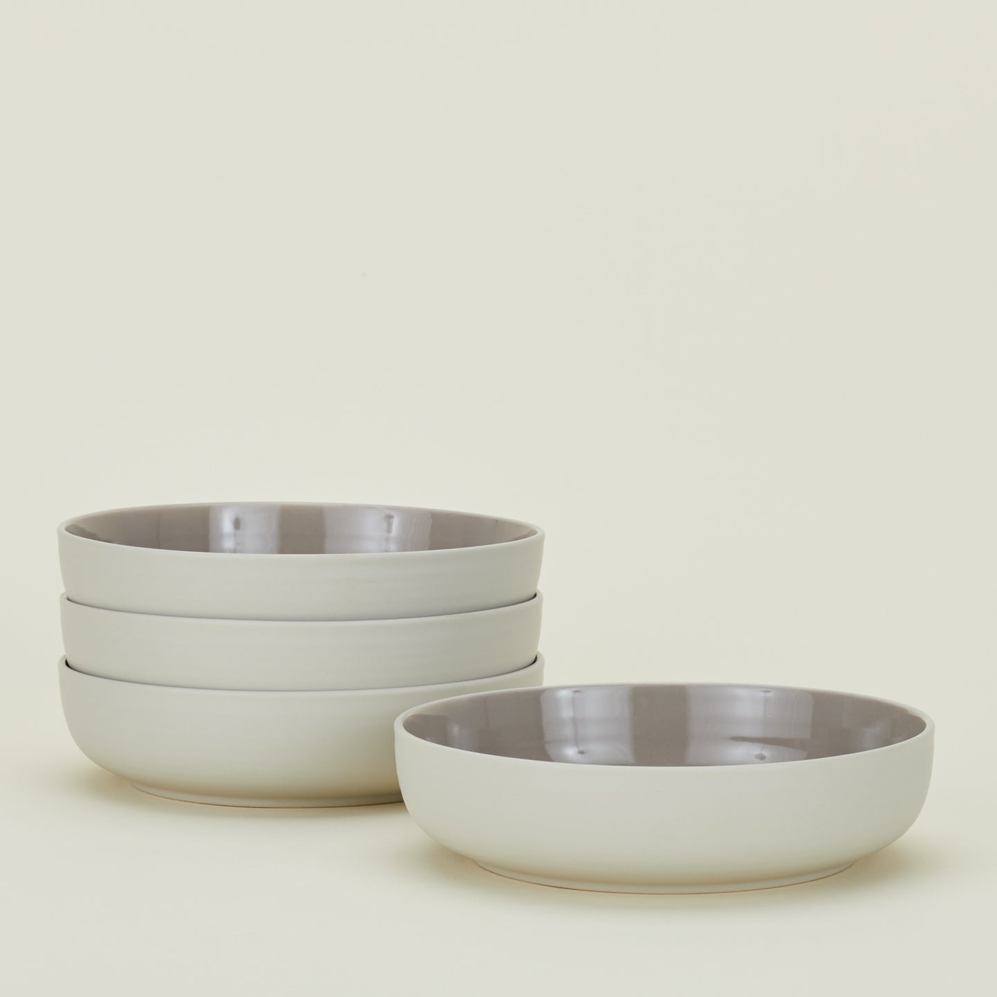 Four Essential Low Bowls in Light Grey.