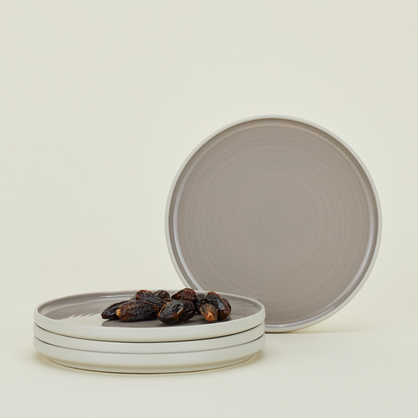 Four Essential Salad Plates in Light Grey, with dates.