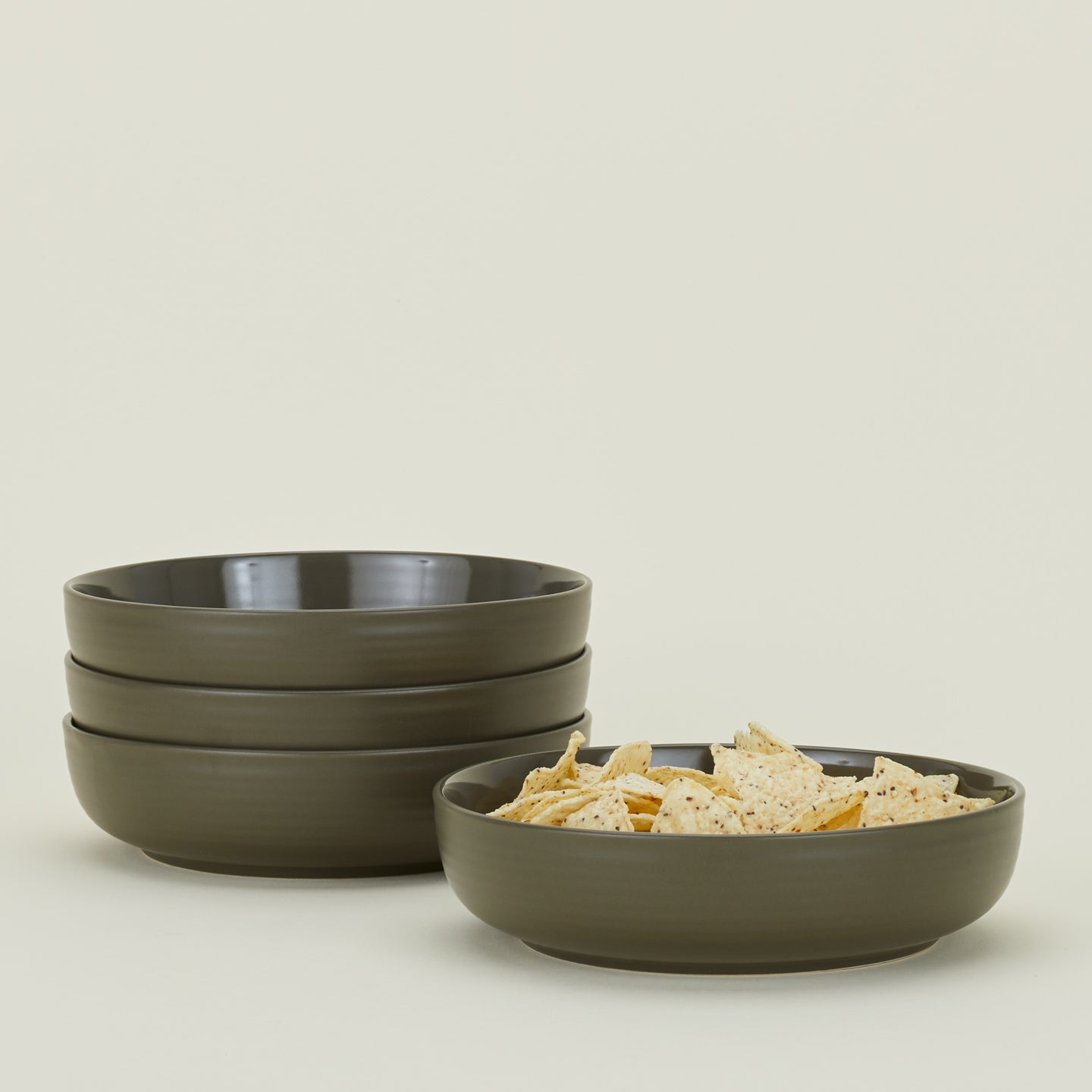 Four Essential Low Bowls in Olive, with tortilla chips.