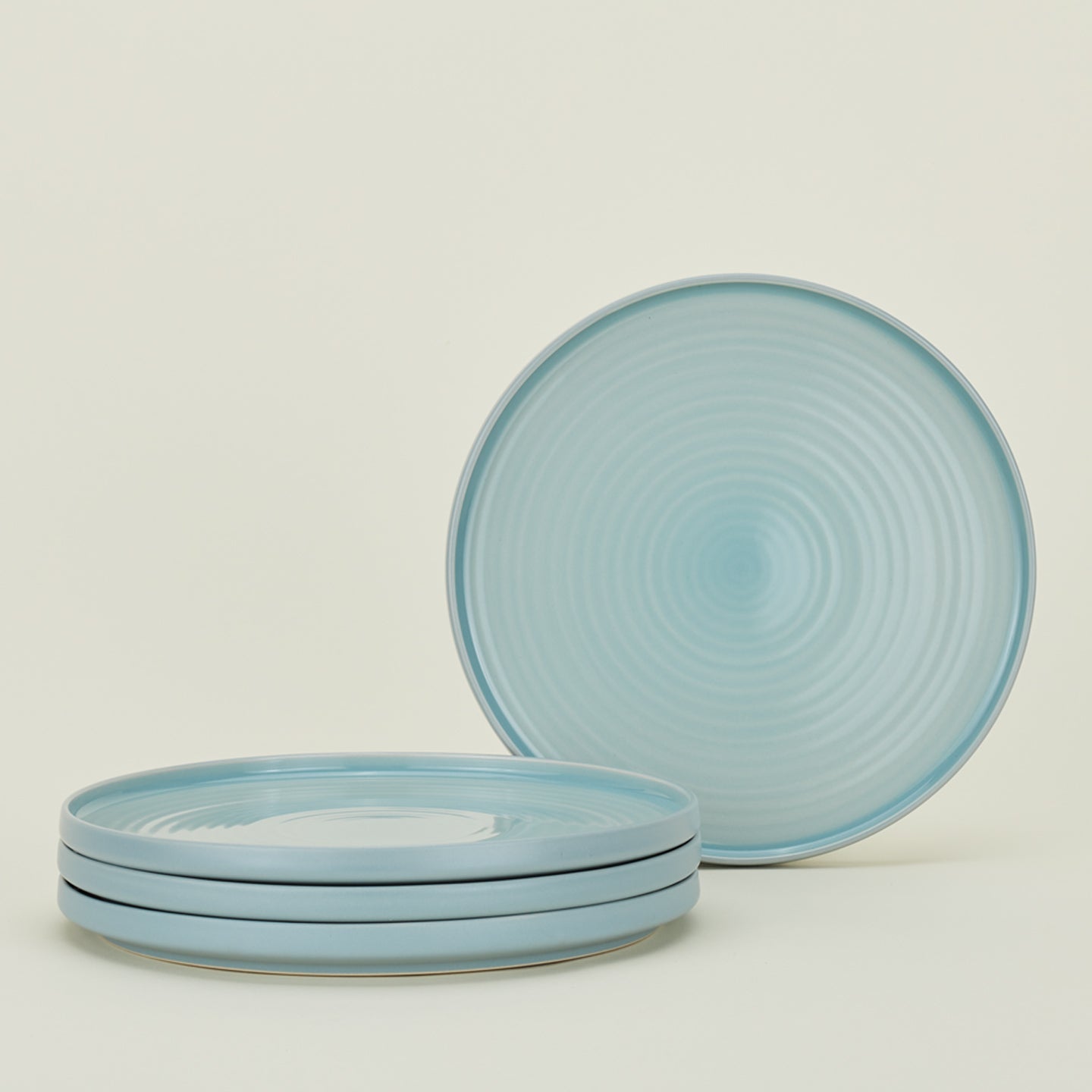 Four sky blue Essential Dinner Plates.