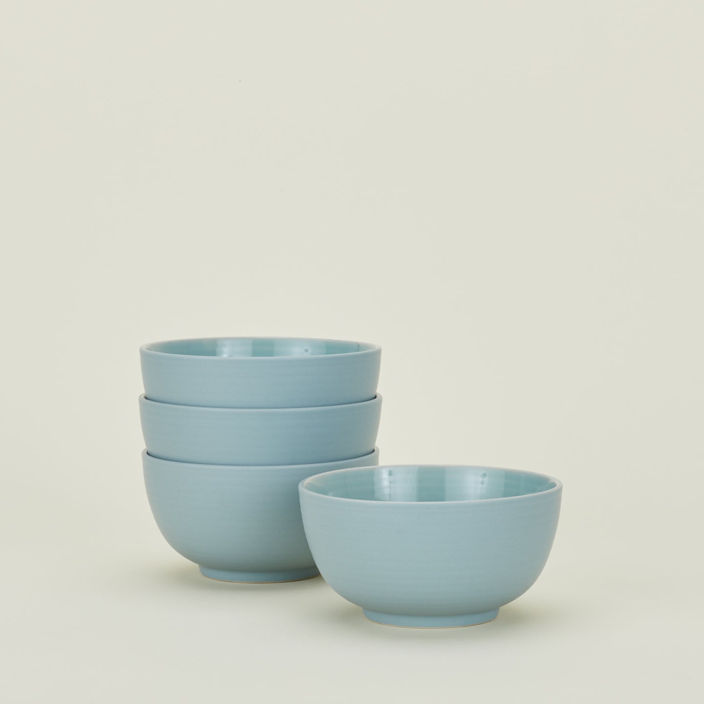 Four sky blue Essential Large Bowls.