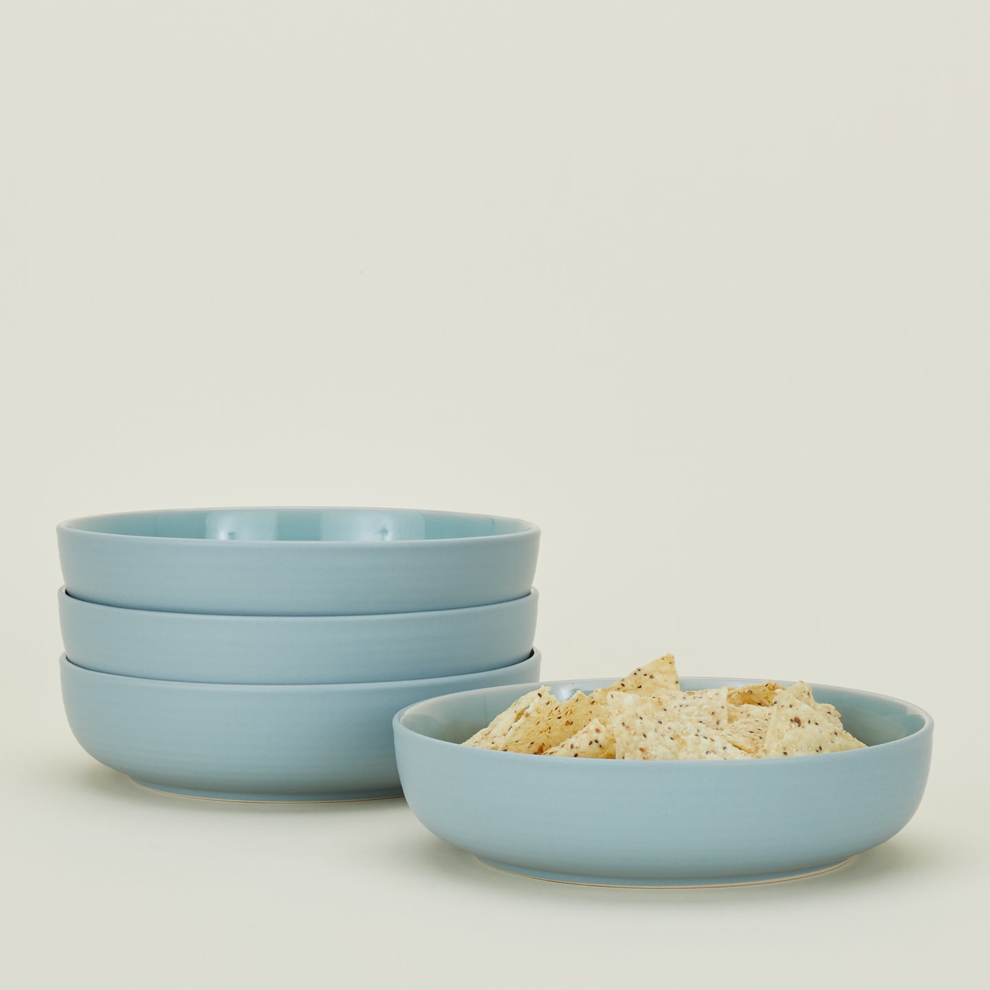 Four Essential Low Bowls in Sky, with tortilla chips.