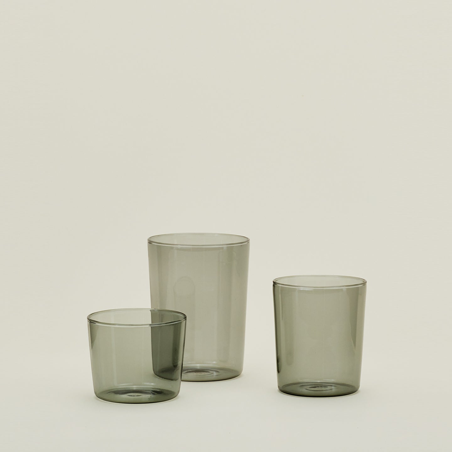 Group of three Essential Glasses in Smoke in Small, Medium and Large sizes.