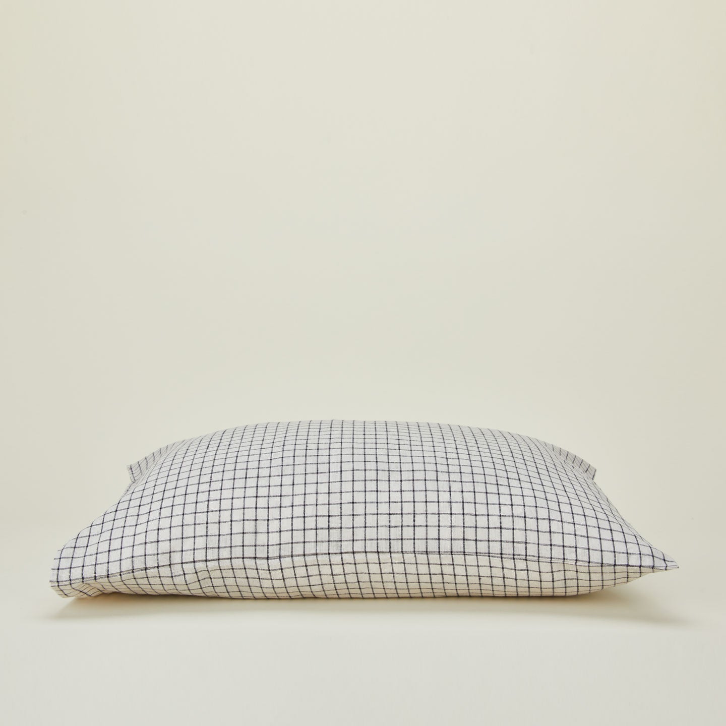 A checked linen pillow case.