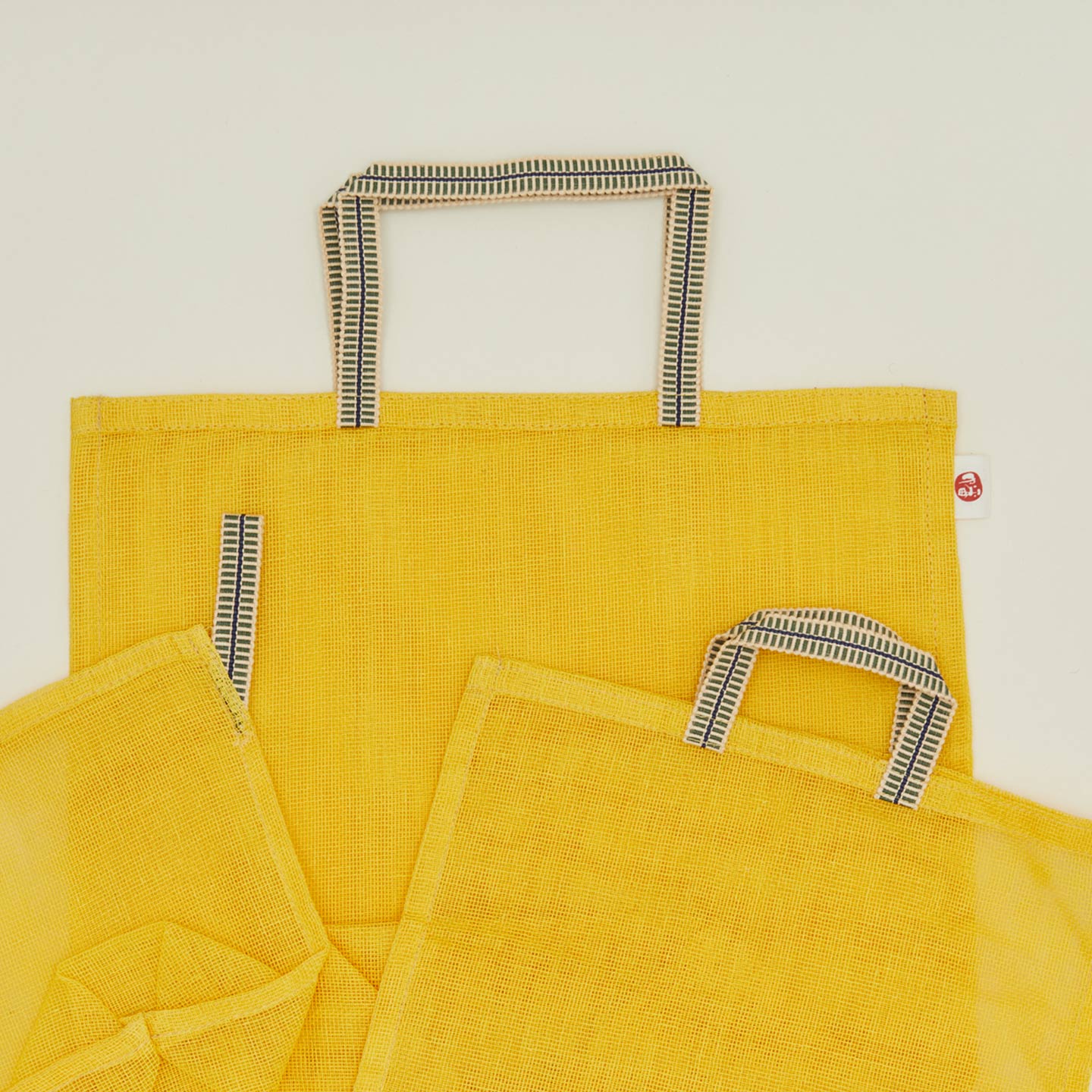 Detailed view of Fort + Field eco produce bags in yellow