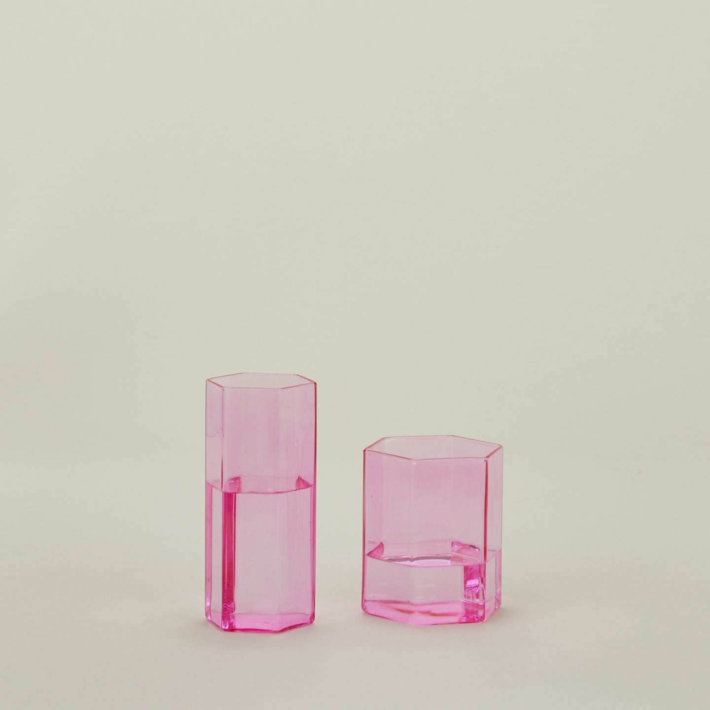 Small and large Helix Glass in Pink with water.