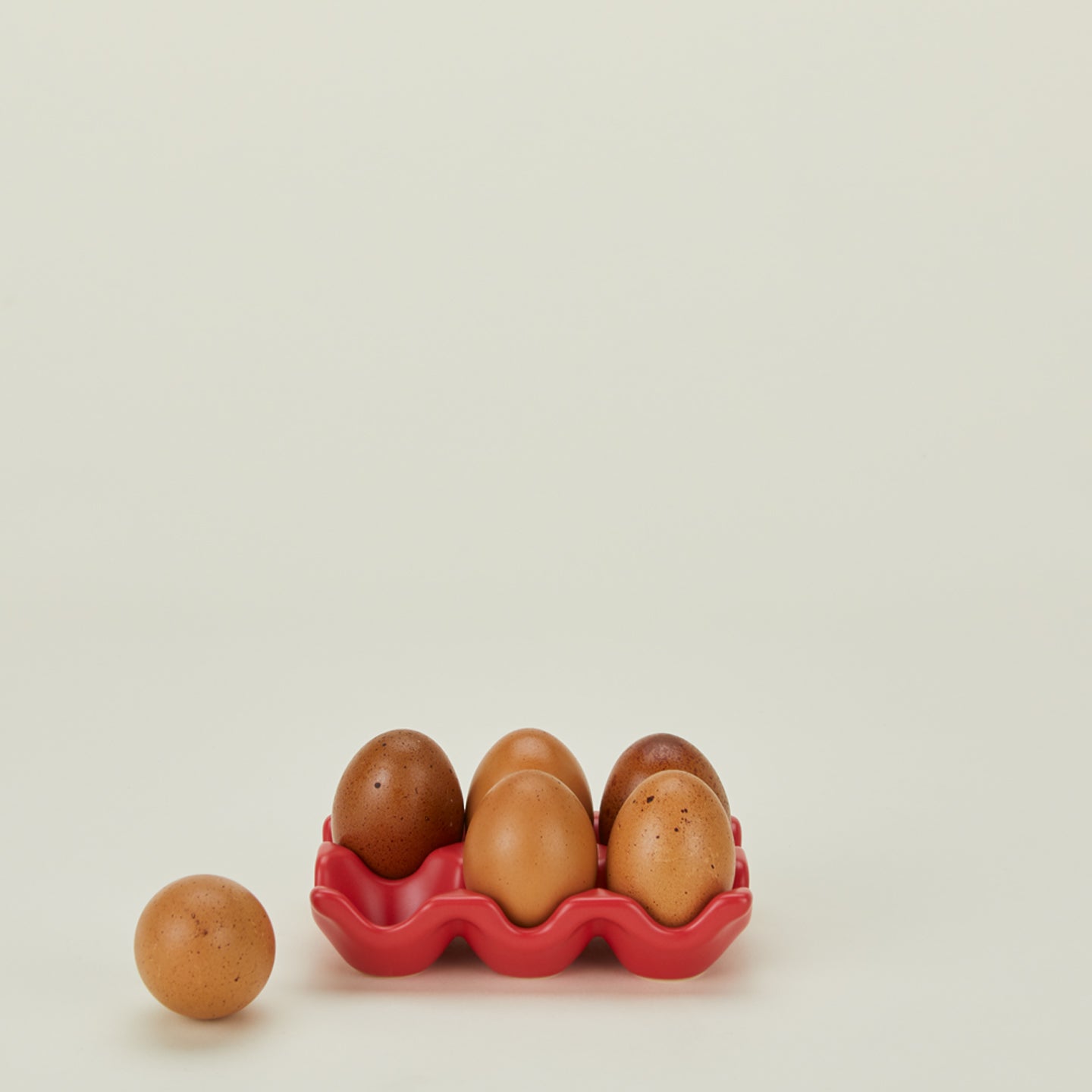 Ceramic half dozen egg holder in red with eggs