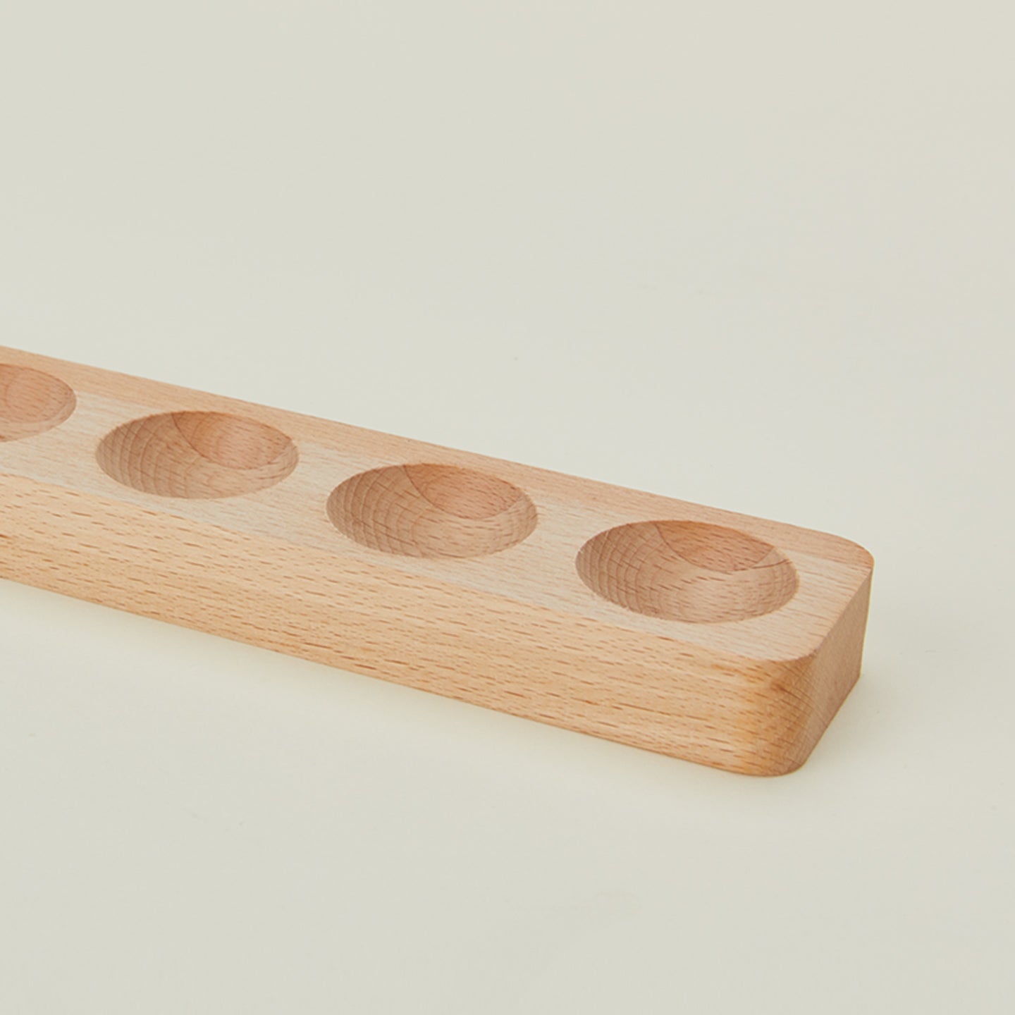 Detail view of wooden egg holder in half dozen size