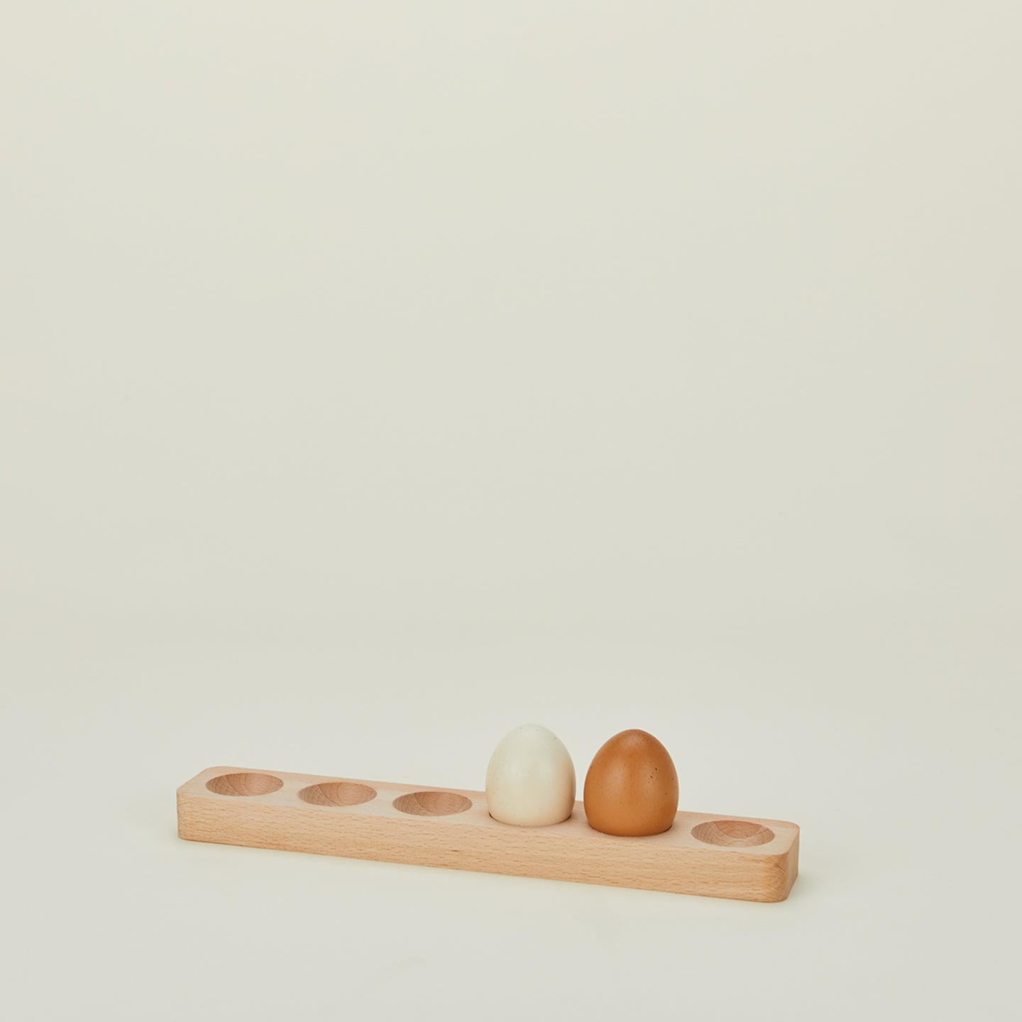 Half dozen wooden egg holder with eggs