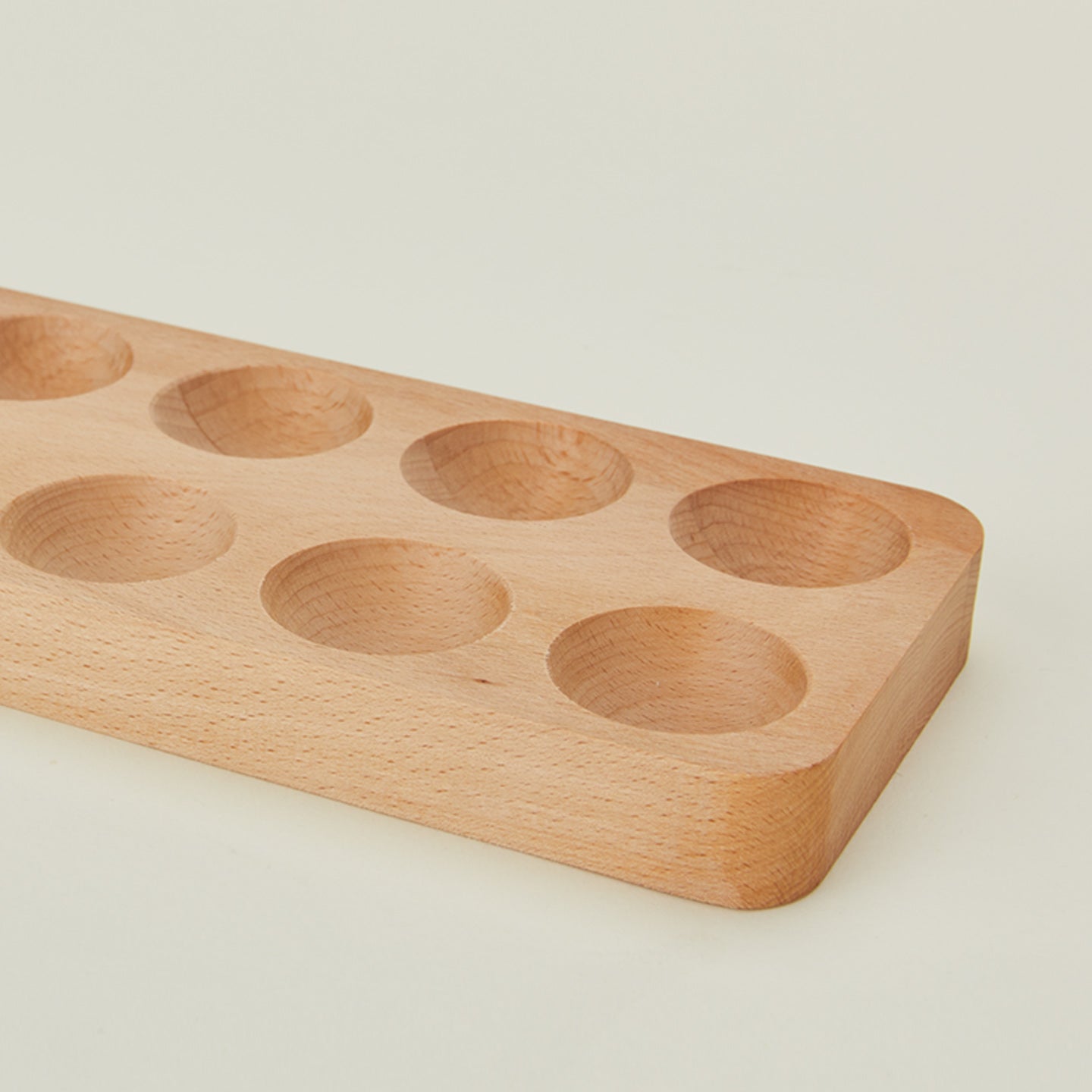 Detail view of wooden egg holder in dozen size