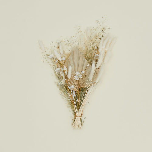 Dried floral bouquet in neutral colors.