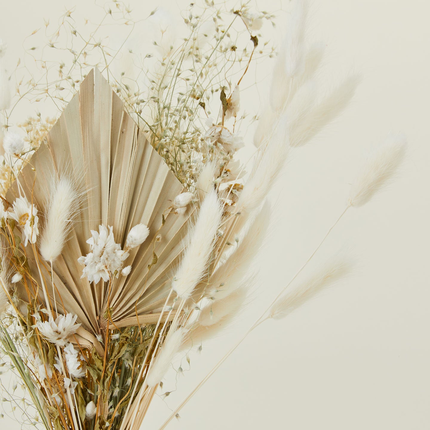 Close up of dried floral bouquet in neutral colors.