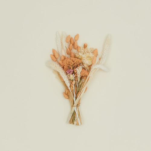 Dried floral bouquet in peaches and cream.