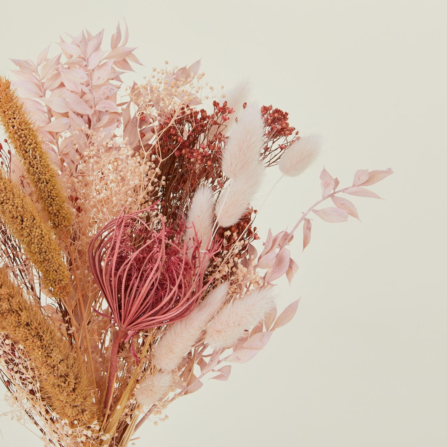 Close up of dried floral bouquet in pink and coral.