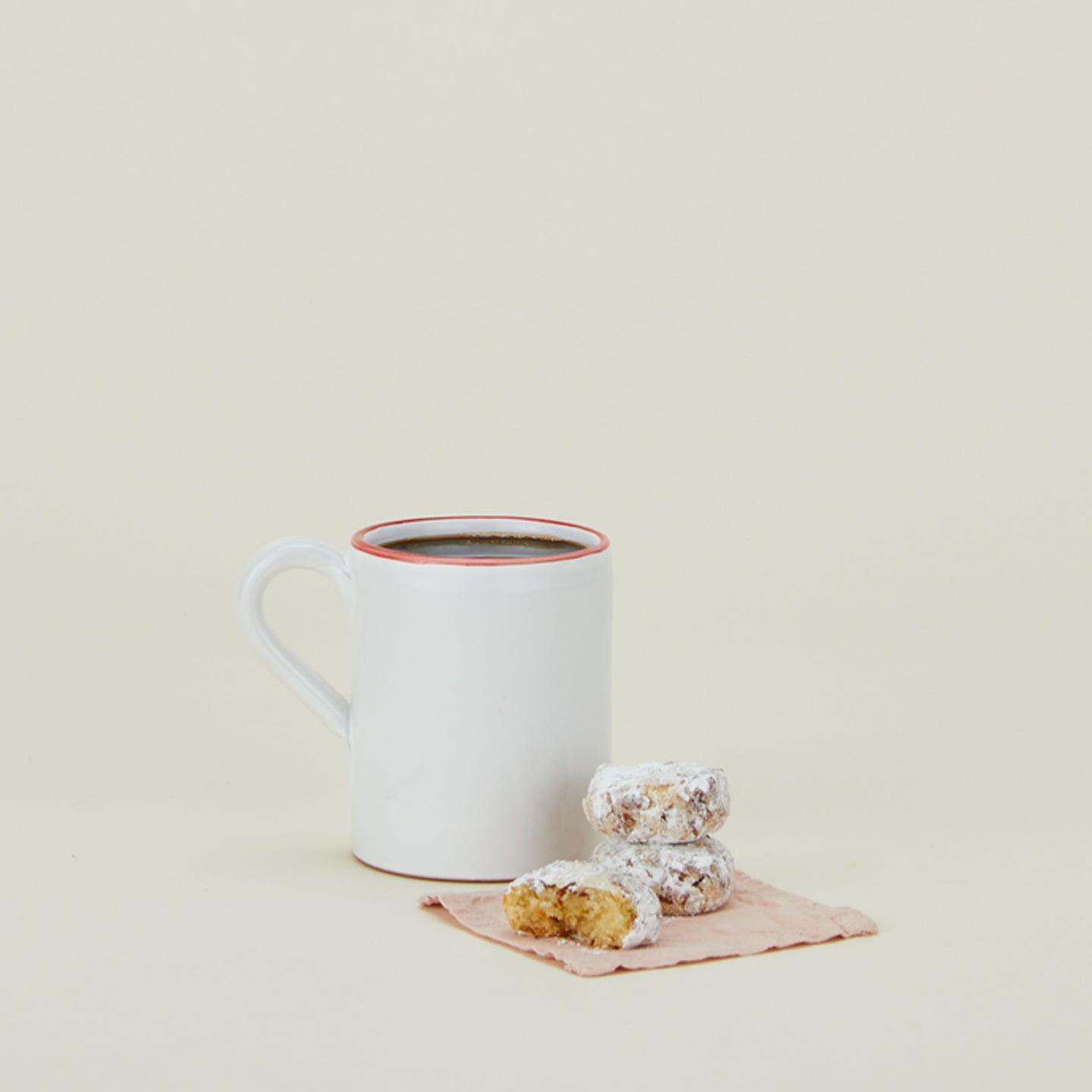 Jore Copenhagen bistro mug in white with red rim with coffee and doughnuts