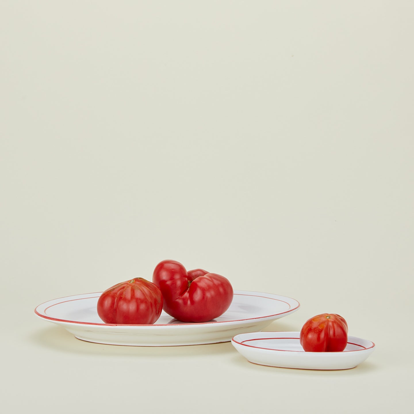 Jore Copenhagen large and small rimmed oval platters with tomatoes 