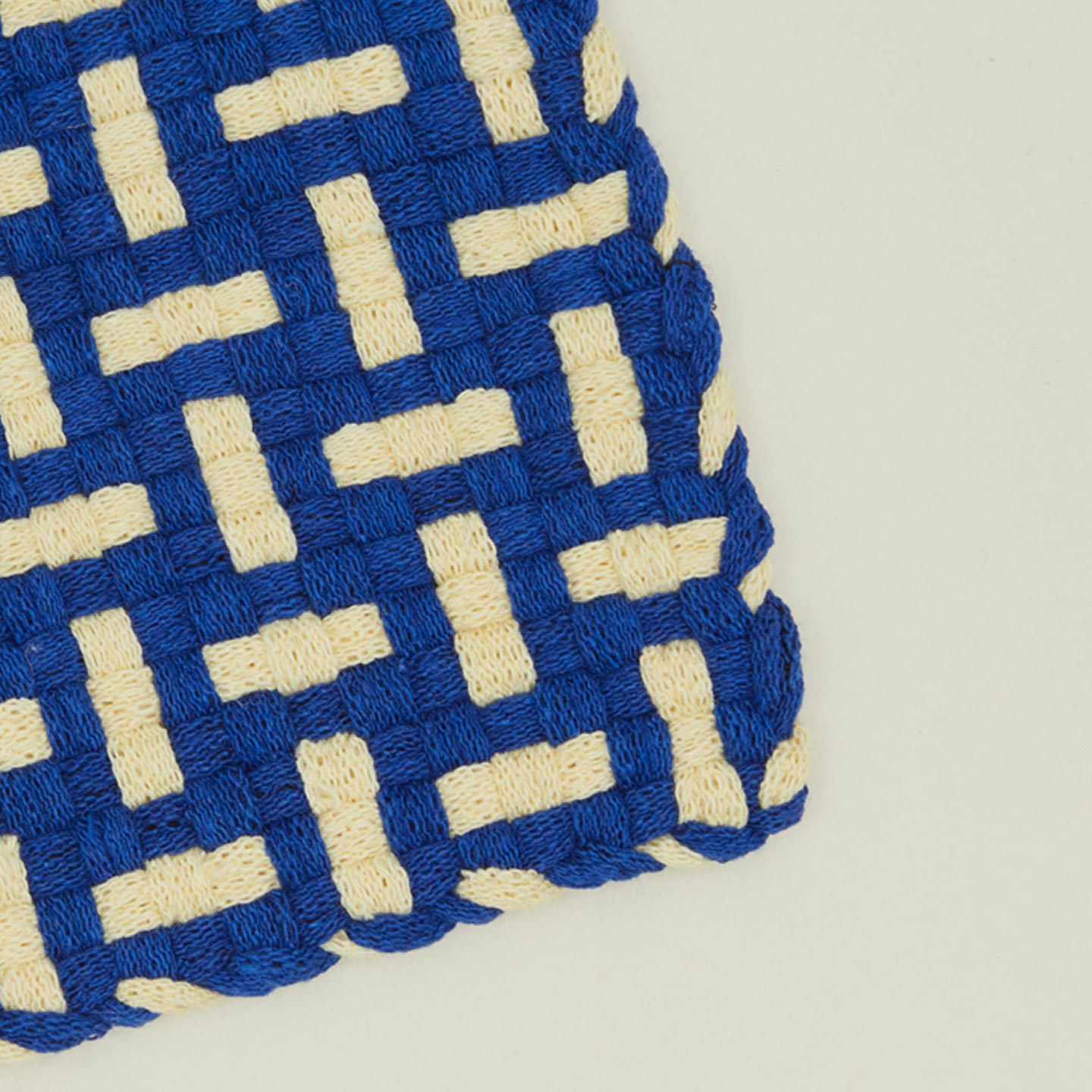 Detail view of parquet potholder in blue and yellow