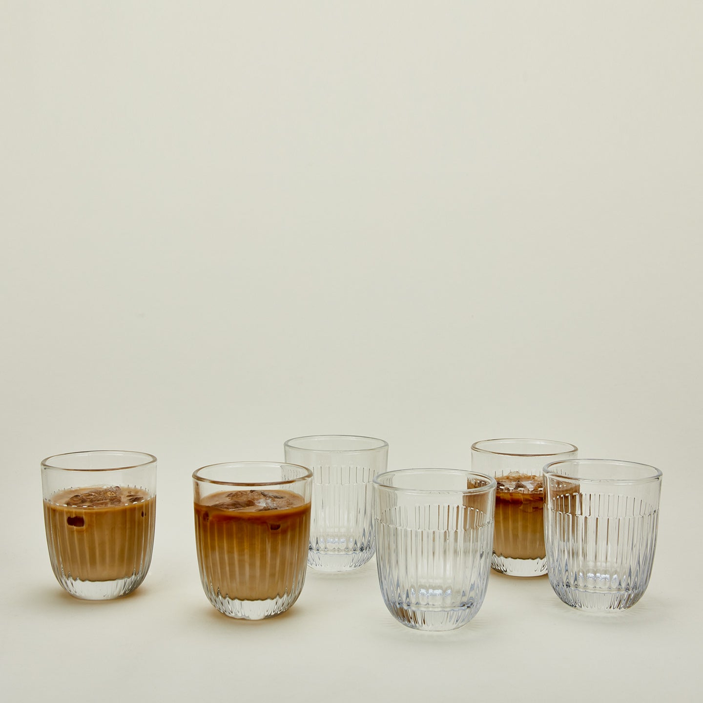 Six Ouessant tumbler glasses, some with iced coffee.