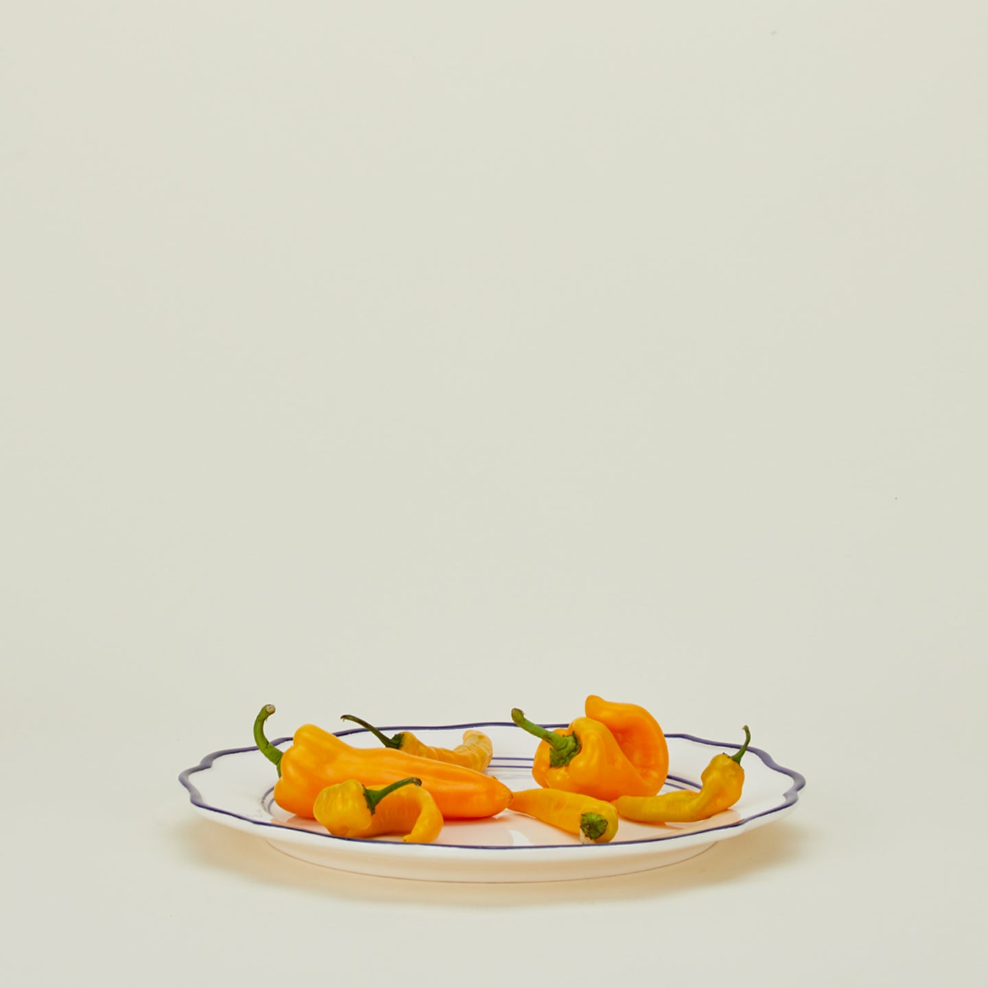 Maison Madison ogee edge round platter with peppers