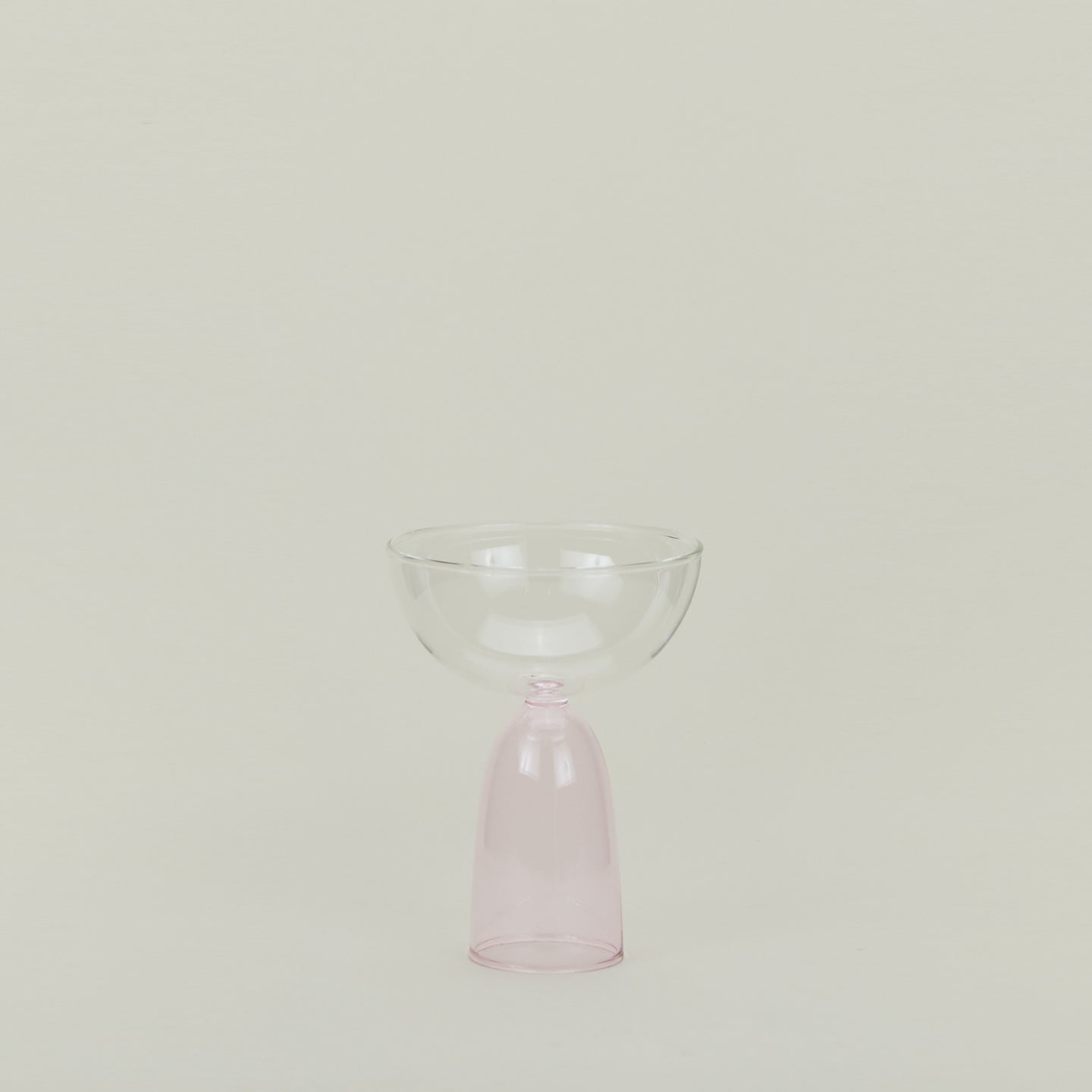 Coupe glass with blush stem and clear cup.