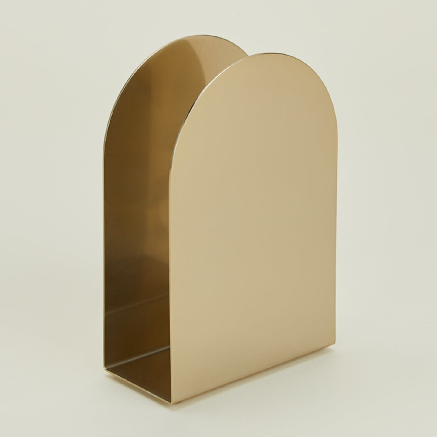 Close up of Arco brass napkin holder.