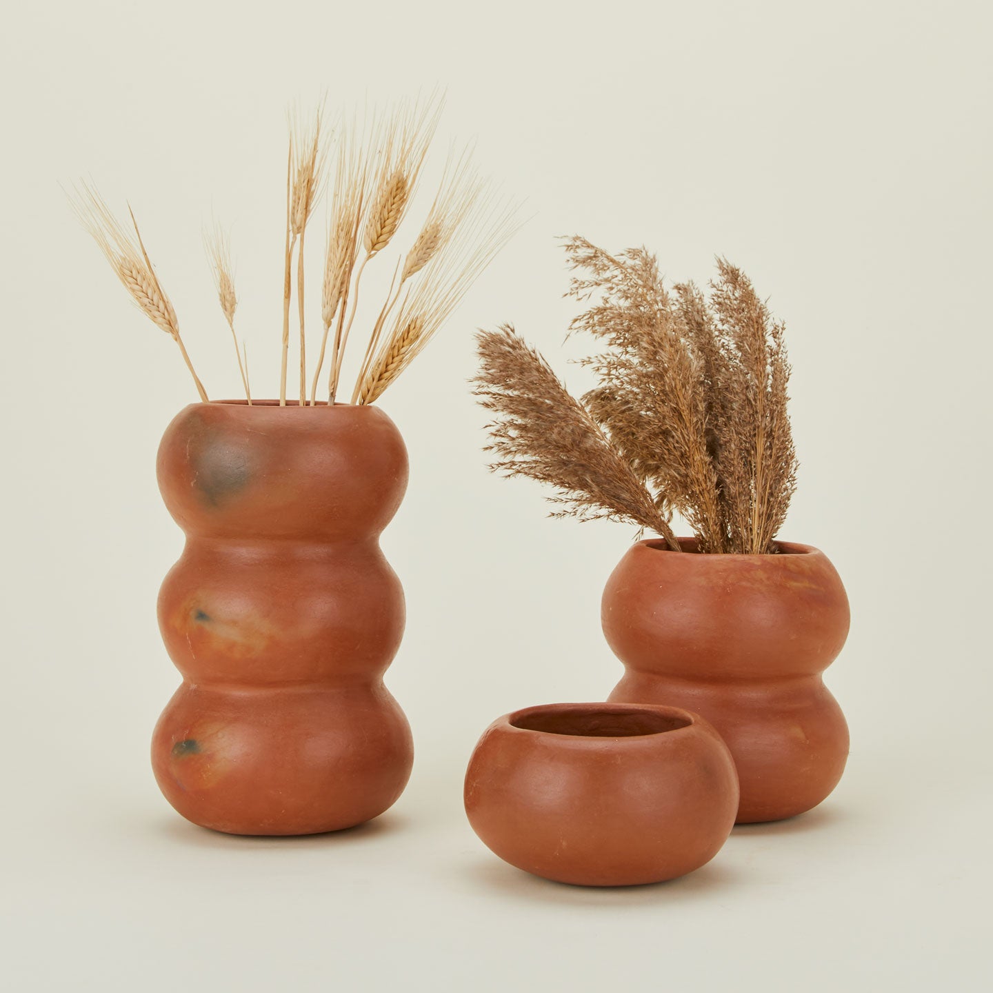 Chinautla terracotta objects in three sizes with florals.