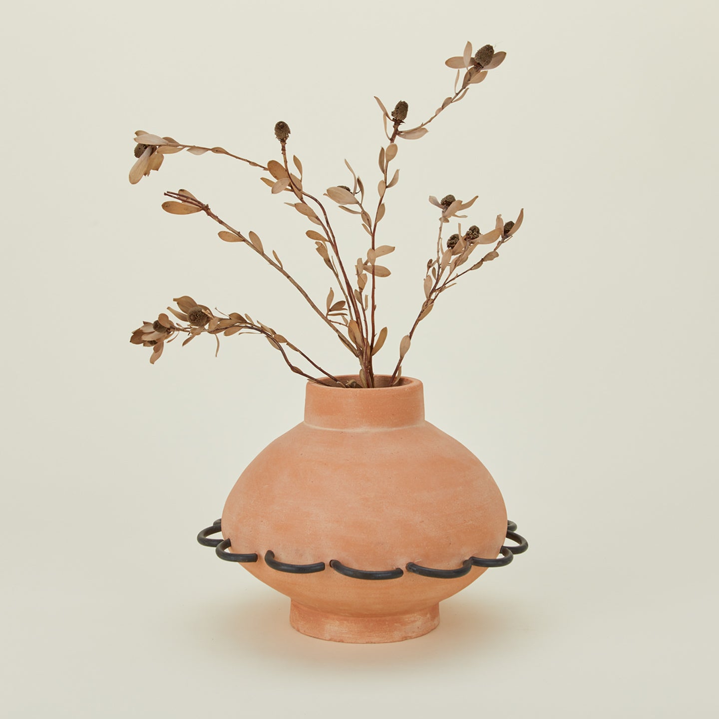 Eli terracotta and iron vessel with florals.