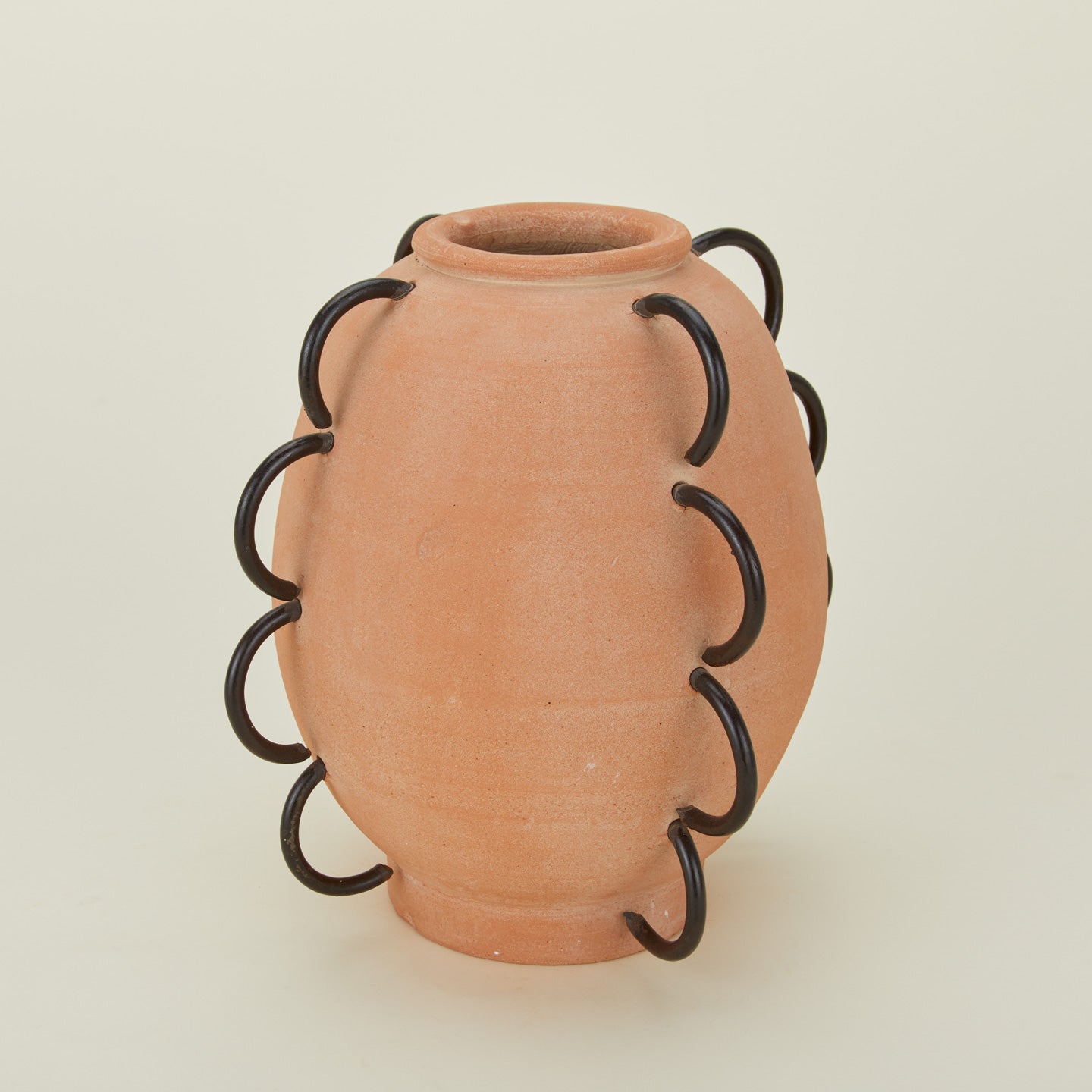 Close up of Ella terracotta and iron vessel.