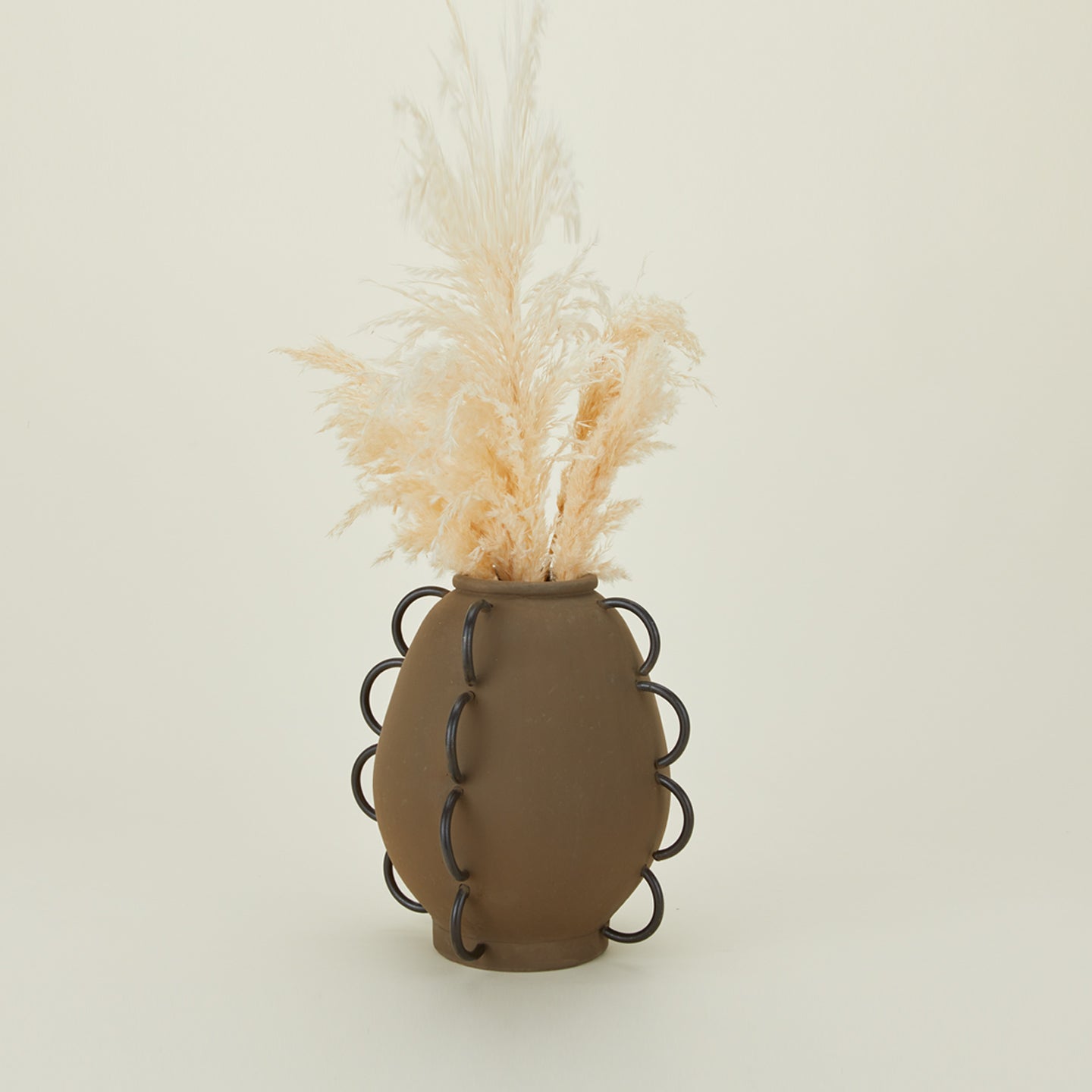 Elliot terracotta and iron vessel with florals.