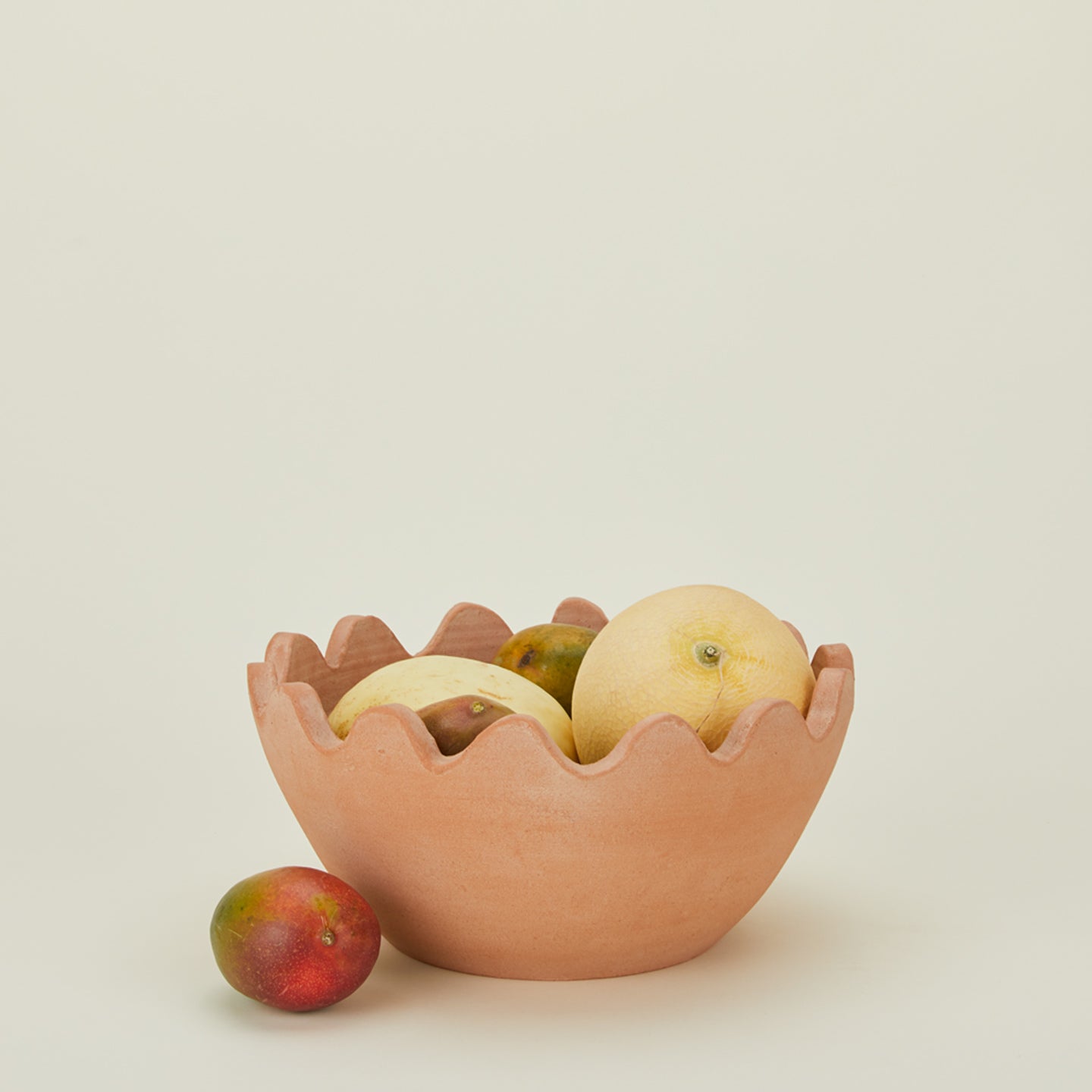 Ena terracotta bowl with ridged edges, and fruit..