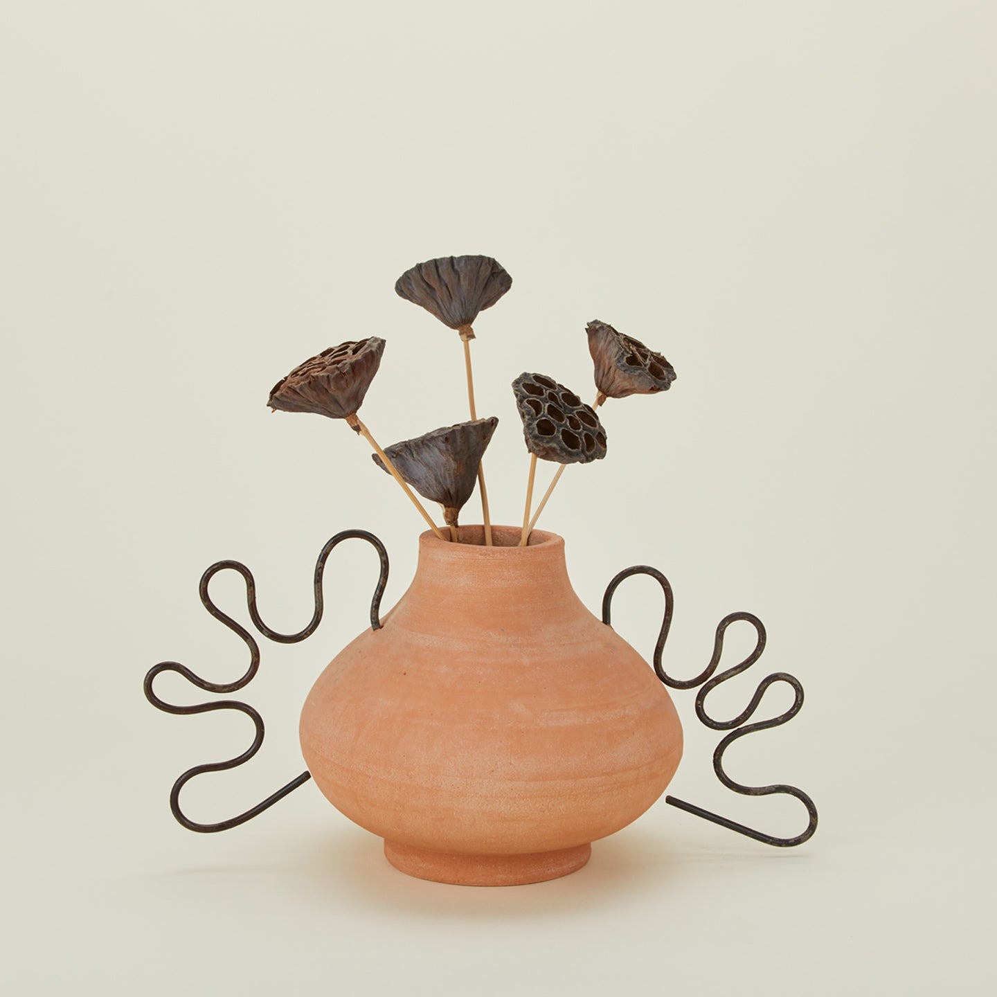 Ines terracotta and iron vessel with florals.