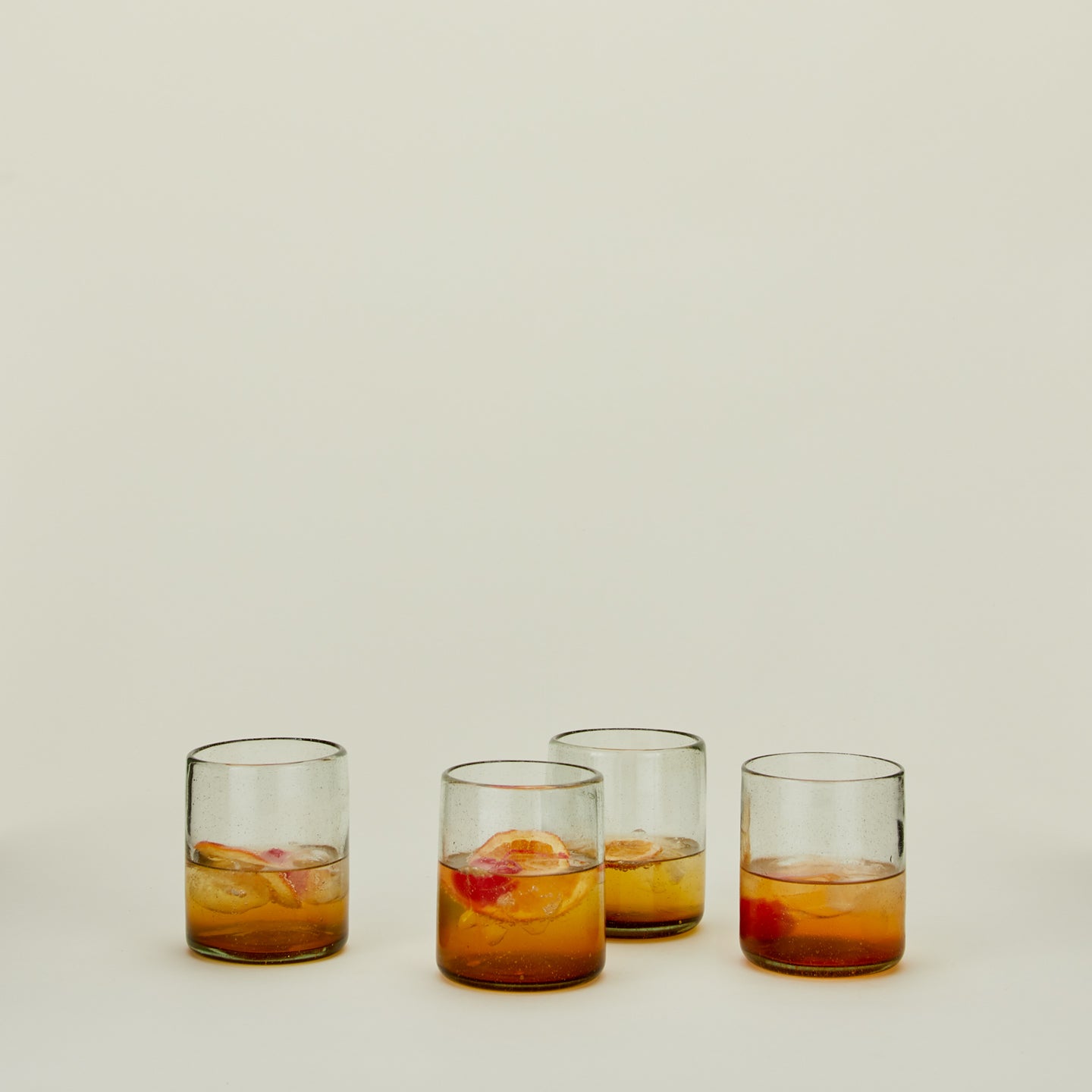 Set of four Sofia ombre glasses in medium with cocktail.