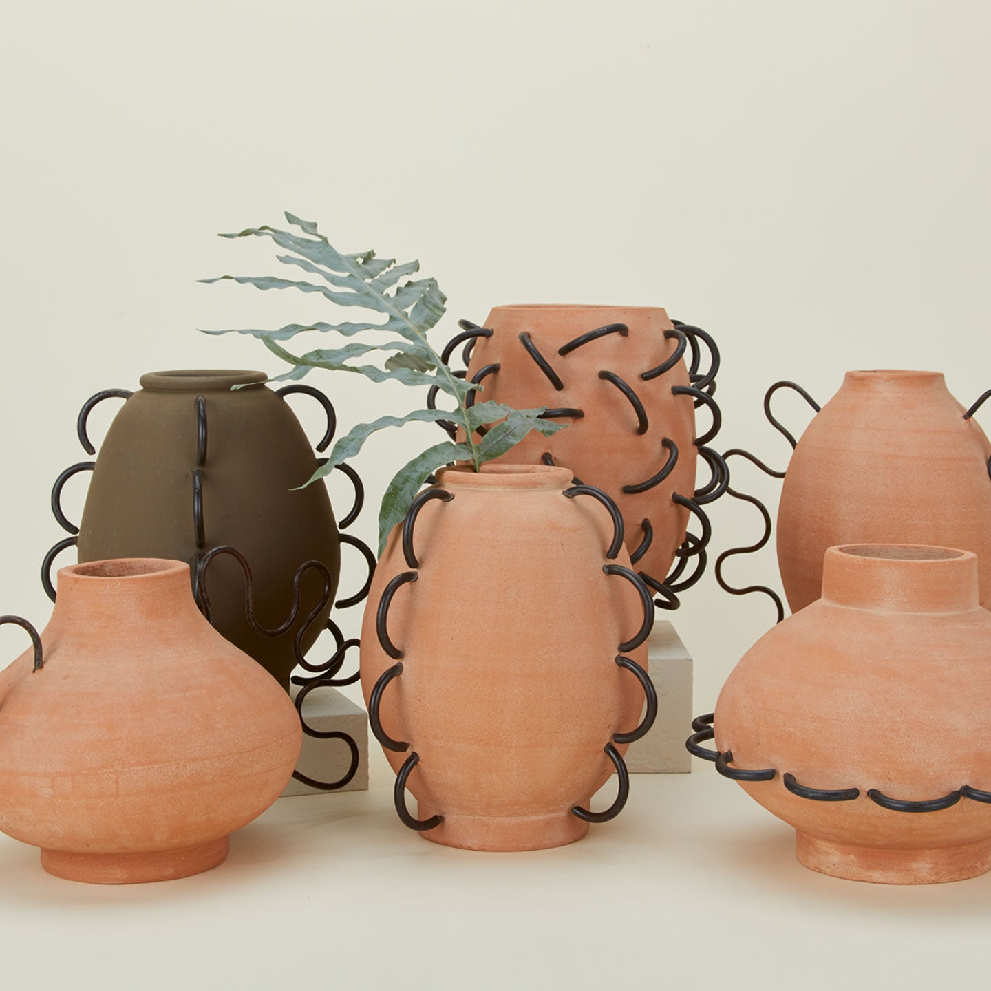 Terracotta and iron vessels in various shapes and sizes.