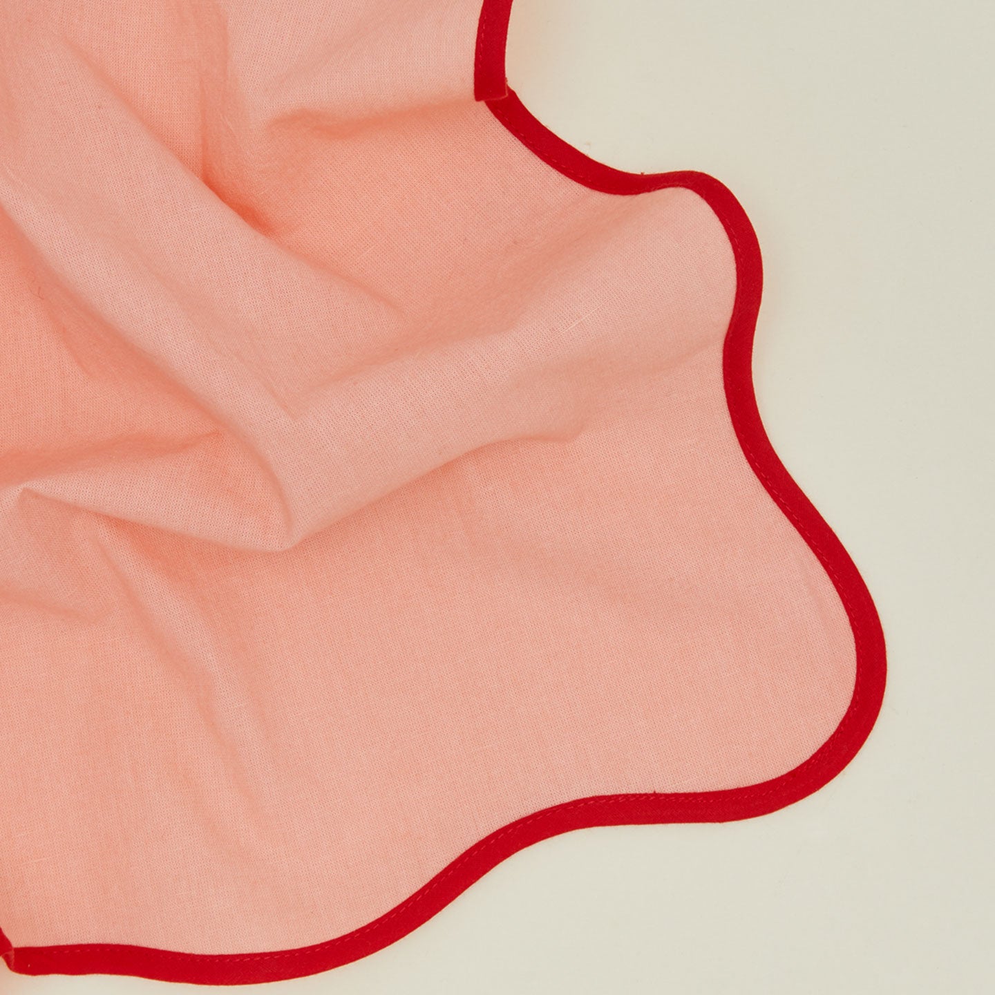 Detailed view of tomato scalloped napkin