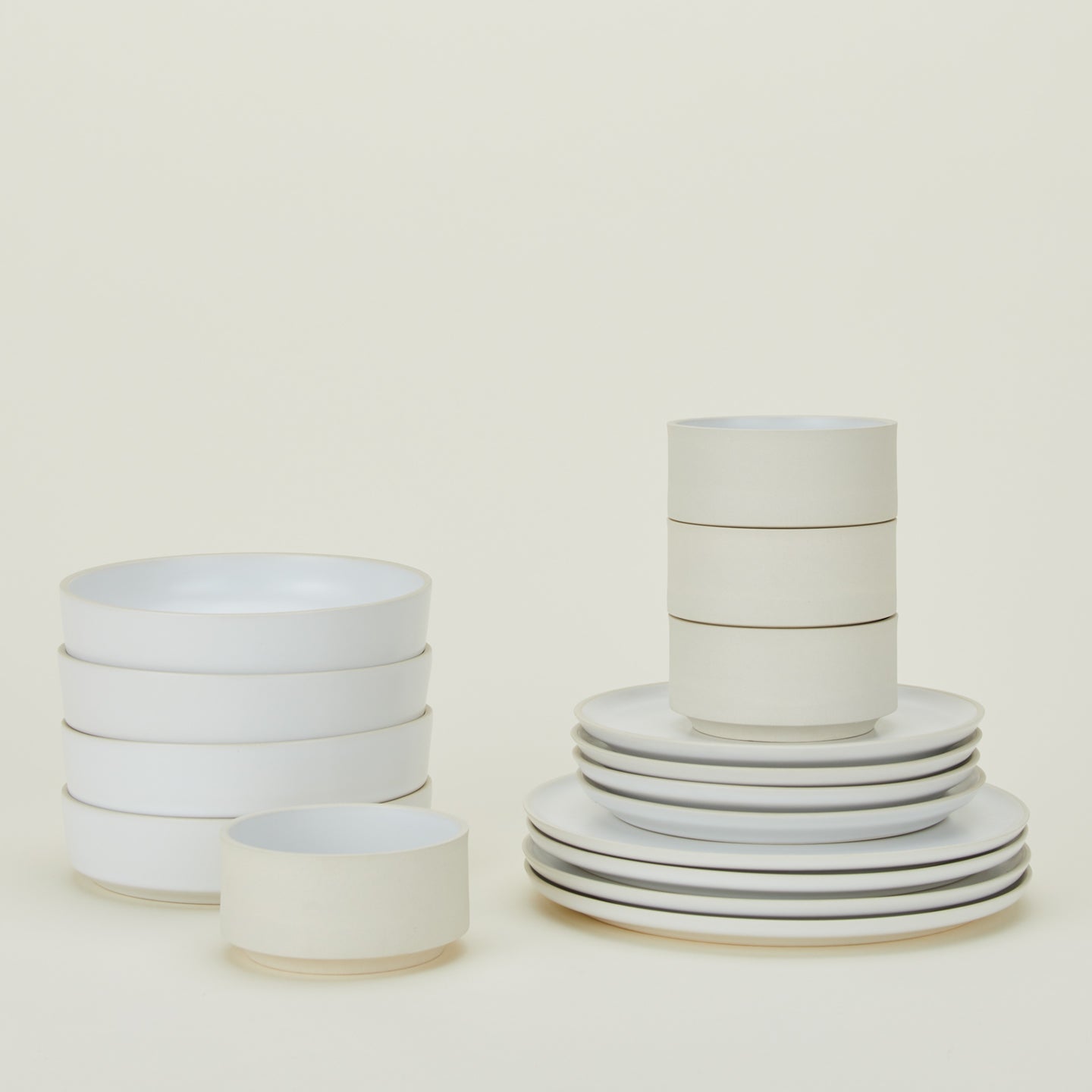 Stacked group of Modernist Dinnerware including four each low bowls, cereal bowls, salad plates and dinner plates.