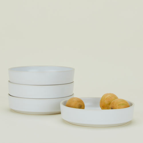 Four Modernist Low Bowls with fruit.
