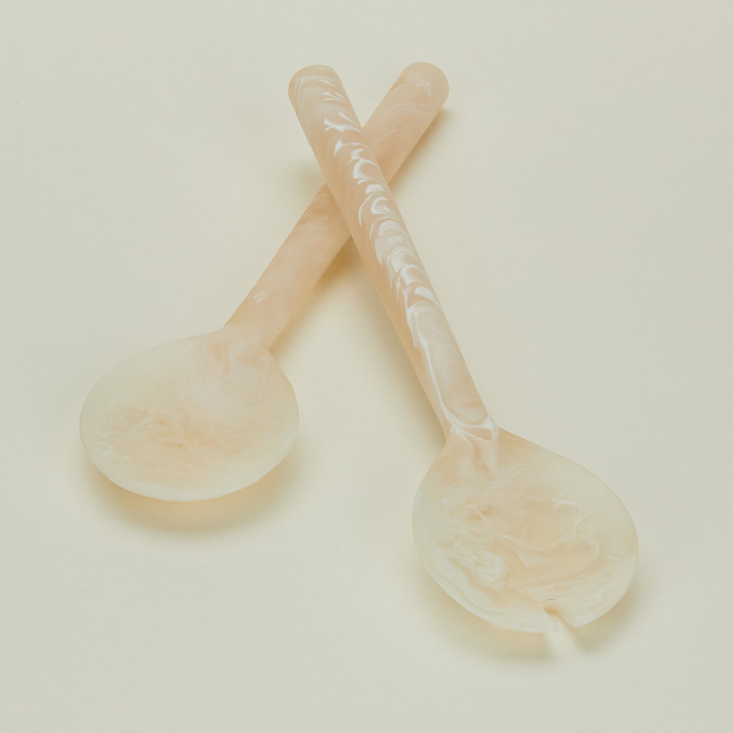 close up of flow resin salad servers