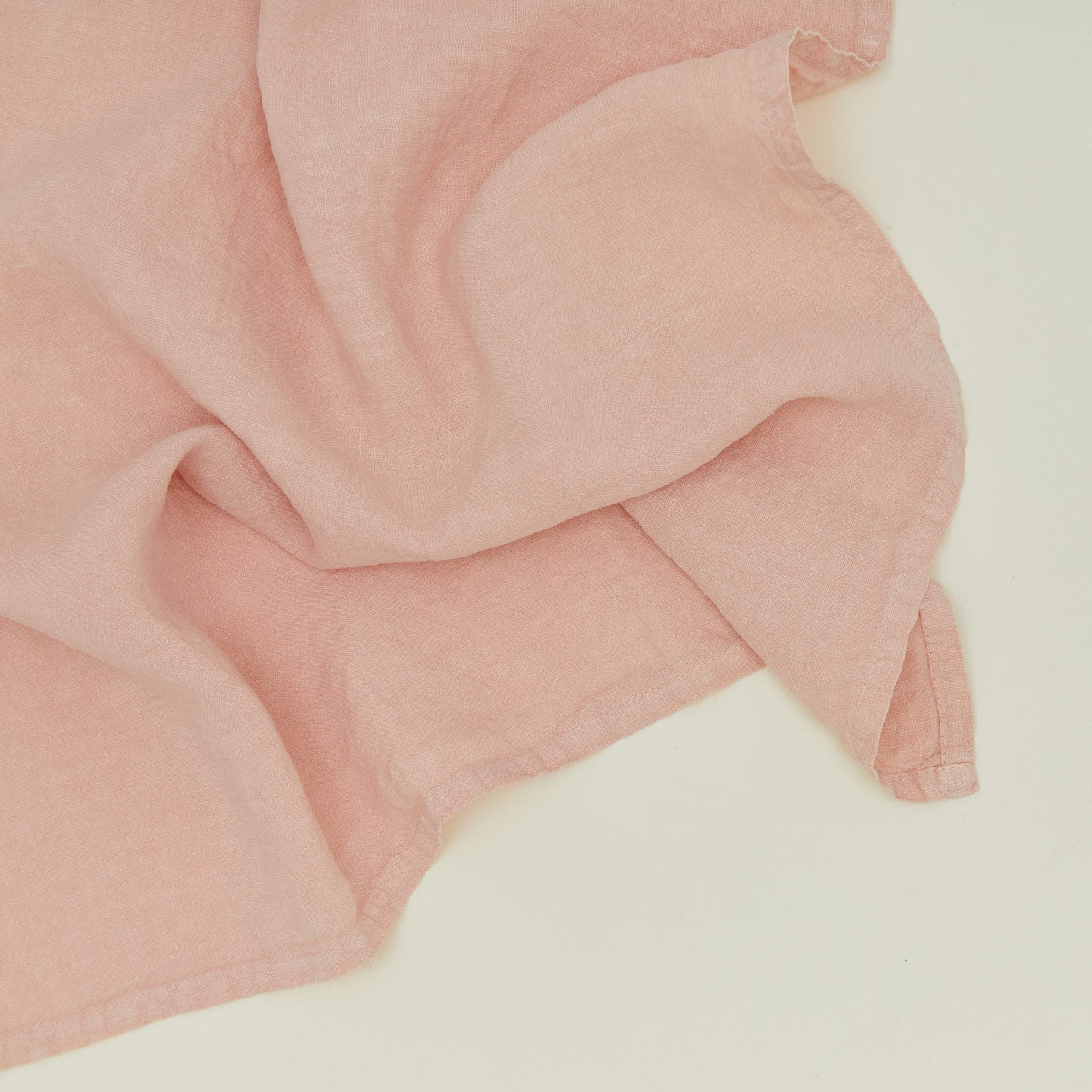 Detailed view of simple linen napkin in blush