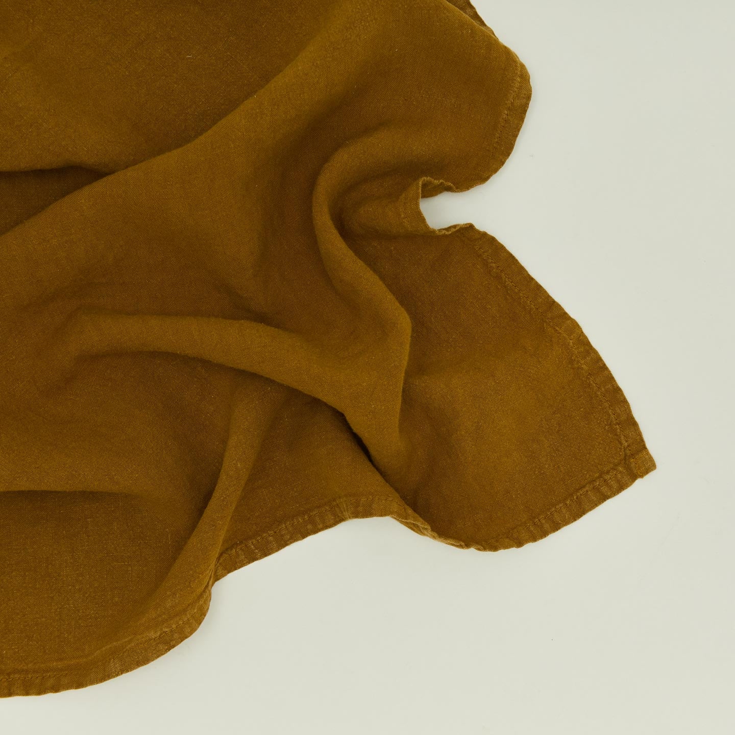 Detailed view of simple linen napkin in bronze