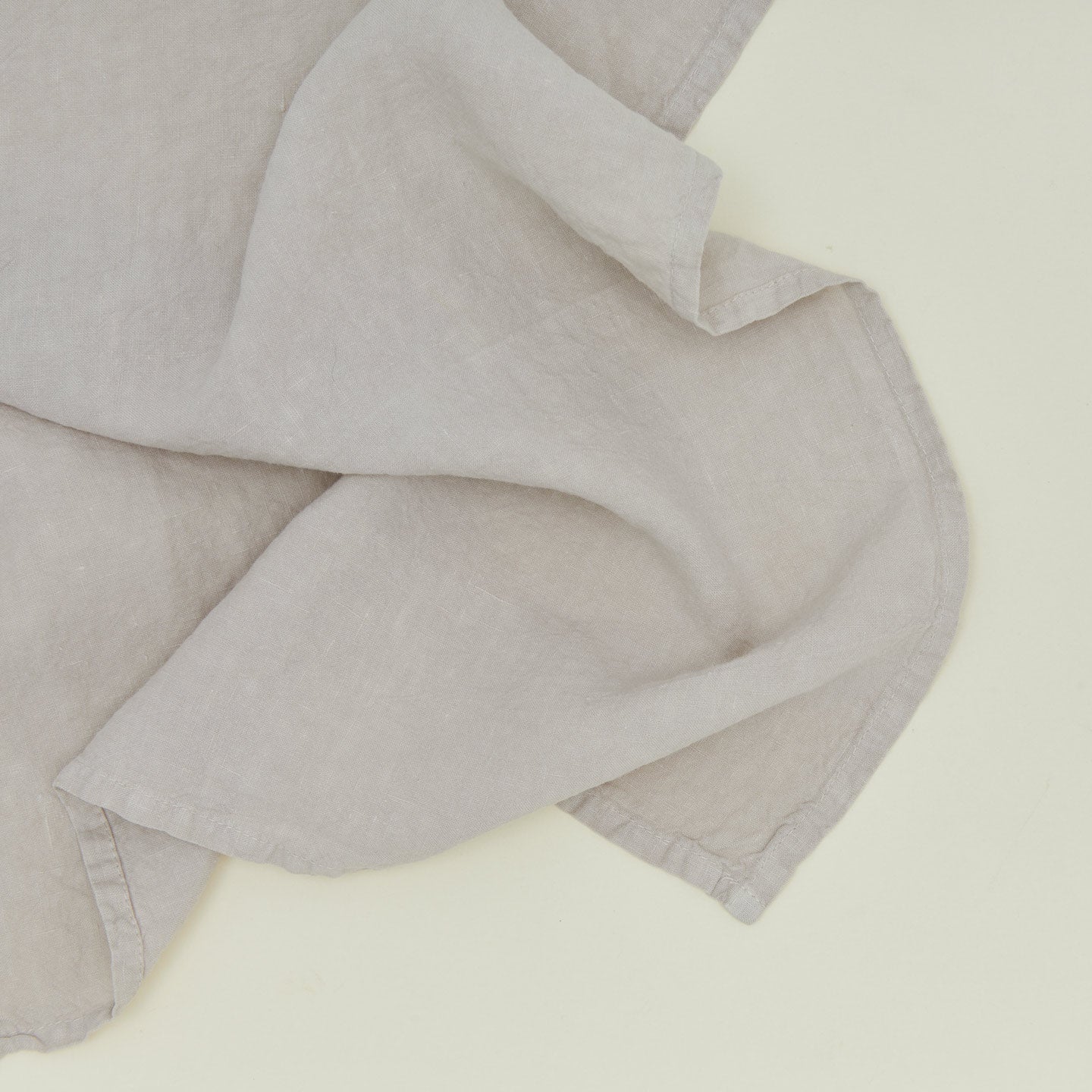 Detailed view of simple linen napkin in light grey