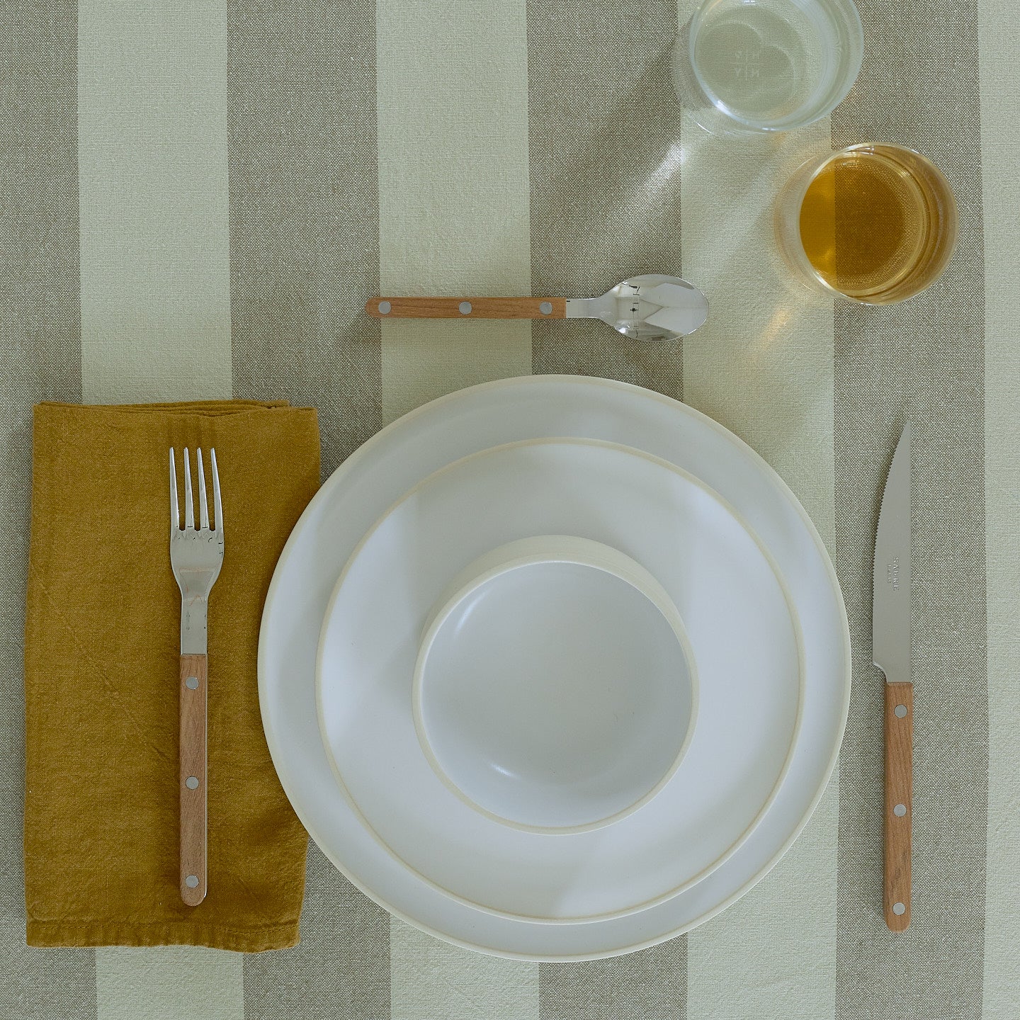 Placesetting with Simple Linen Napkin in Bronze.